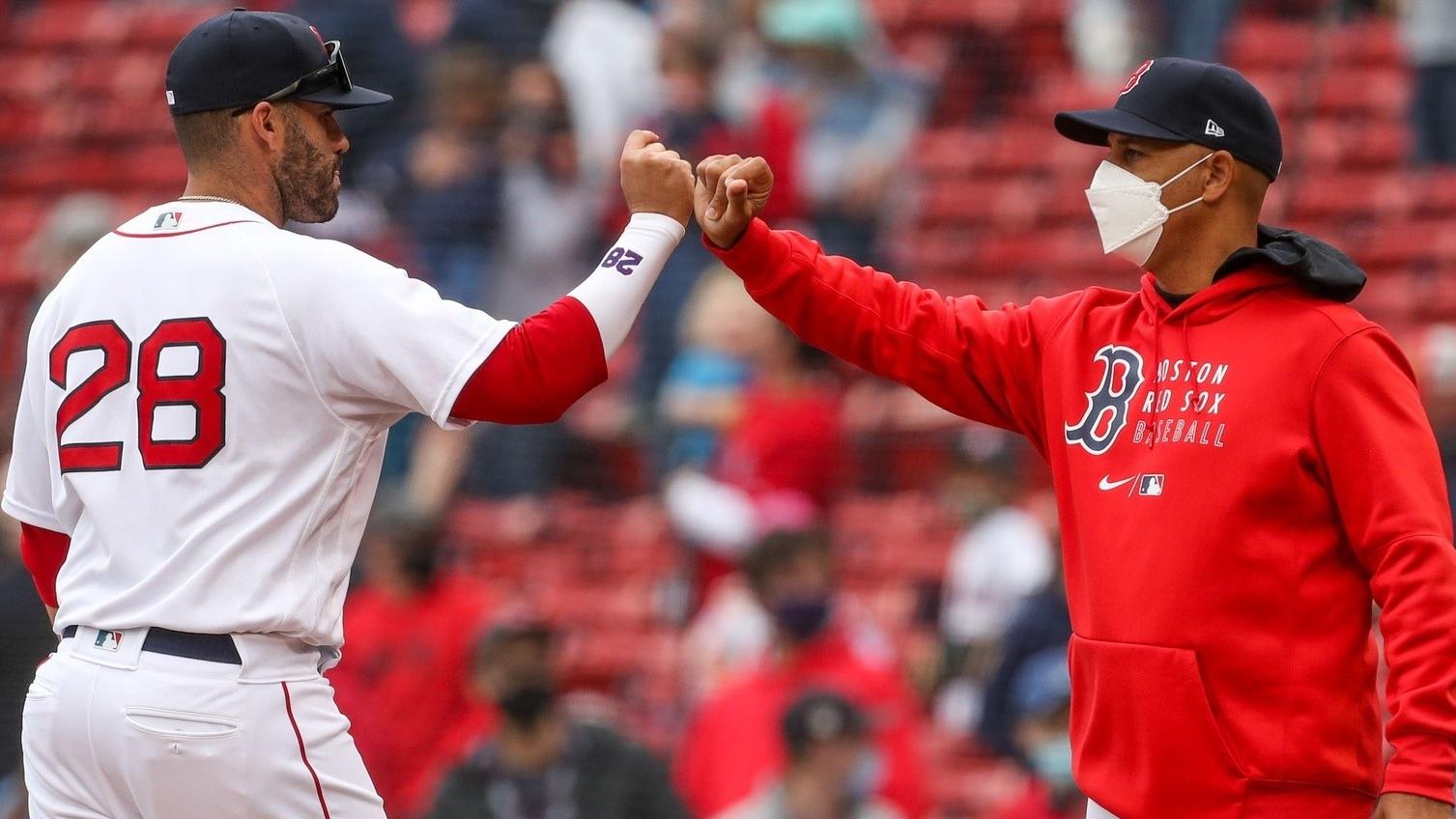 Apr 7, 2021; Boston, Massachusetts, USA; Boston Red Sox Manager Alex Cora (13) and designated hitter J.D. Martinez (28) high five after a win over the Tampa Bay Rays at Fenway Park. / Paul Rutherford-USA TODAY Sports