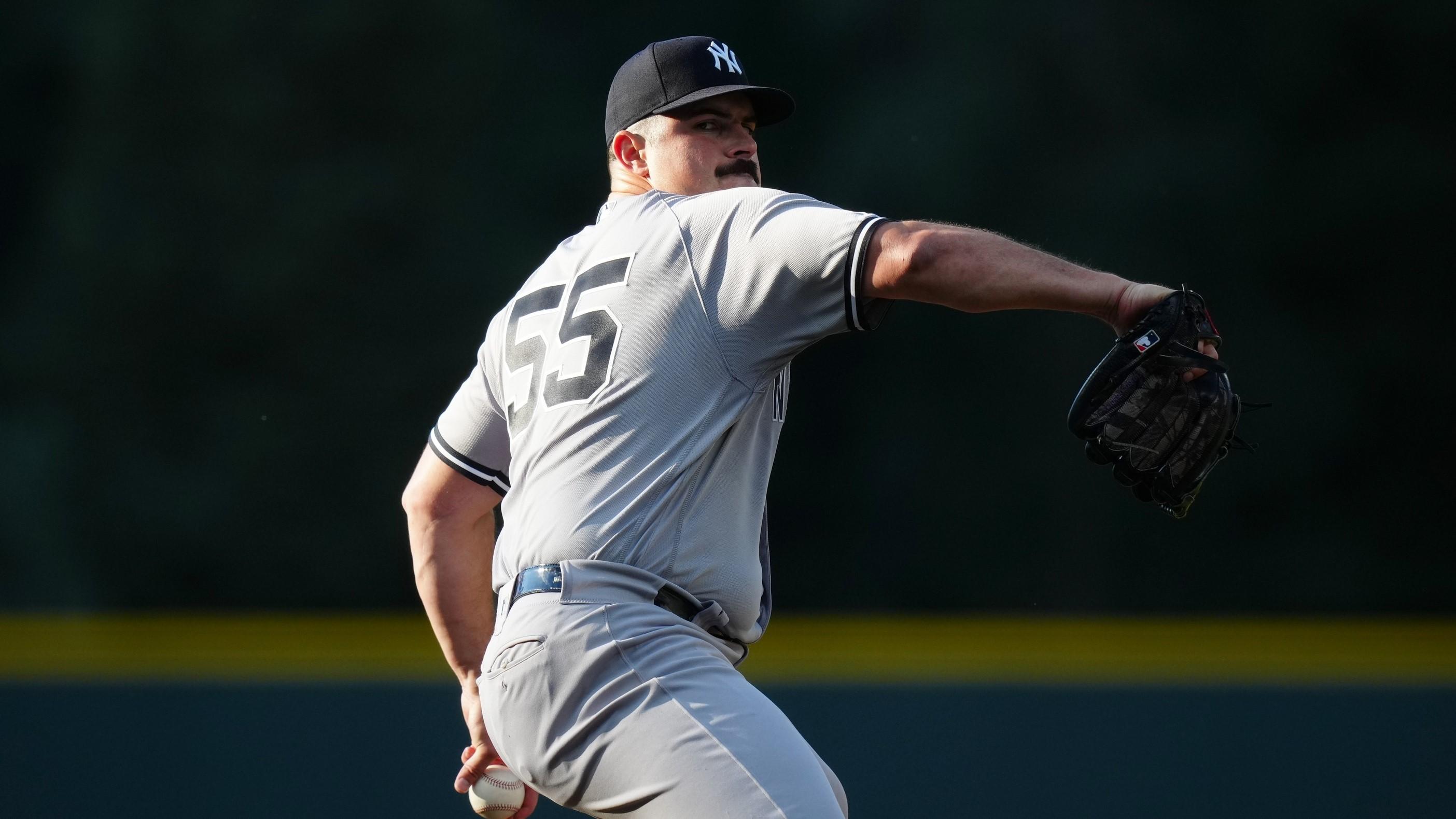 Jul 14, 2023; Denver, Colorado, USA; New York Yankees starting pitcher Carlos Rodon (55) delivers a pitch in the first inning against the Colorado Rockies at Coors Field. / Ron Chenoy-USA TODAY Sports