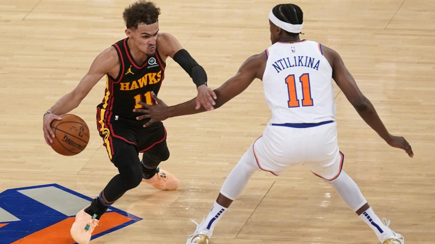 May 23, 2021; New York, New York, USA; New York Knicks guard Frank Ntilikina (11) guards Atlanta Hawks guard Trae Young (11) during the second half in game one in the first round of the 2021 NBA Playoffs at Madison Square Garden. / Seth Wenig/Pool Photo-USA TODAY Sports
