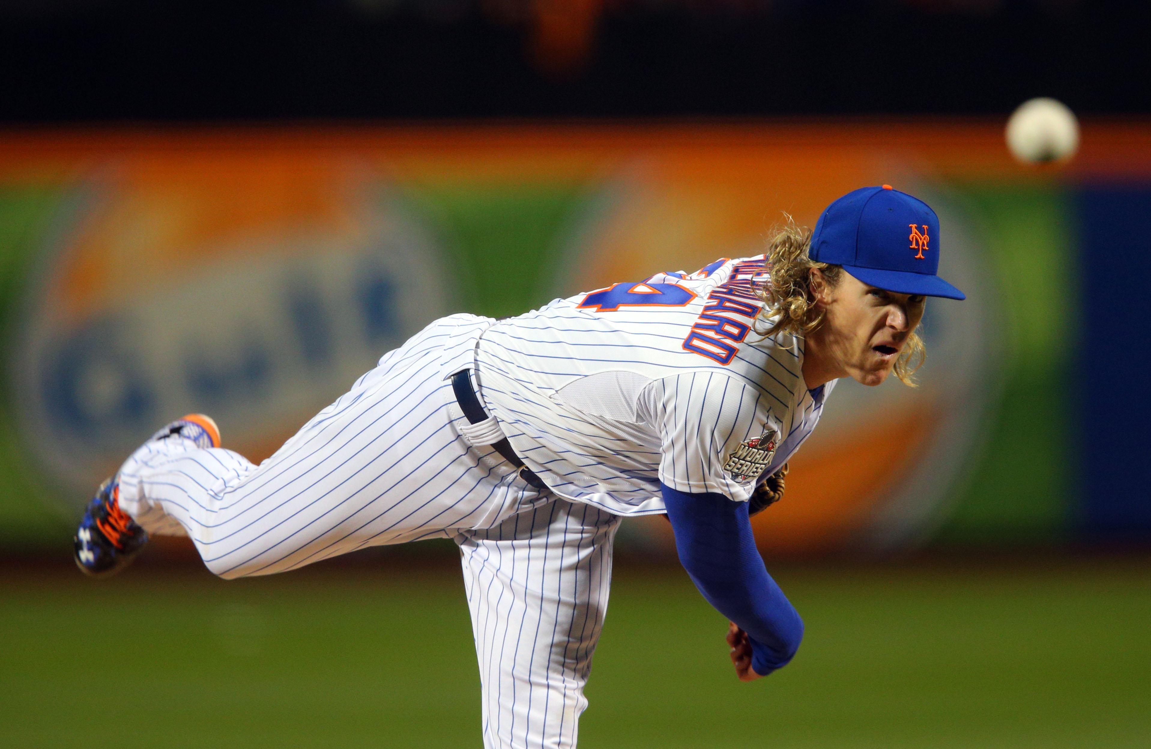 Oct 30, 2015; New York City, NY, USA; New York Mets starting pitcher Noah Syndergaard throws a pitch against the Kansas City Royals in the first inning in game three of the World Series at Citi Field. / Brad Penner-USA TODAY Sports