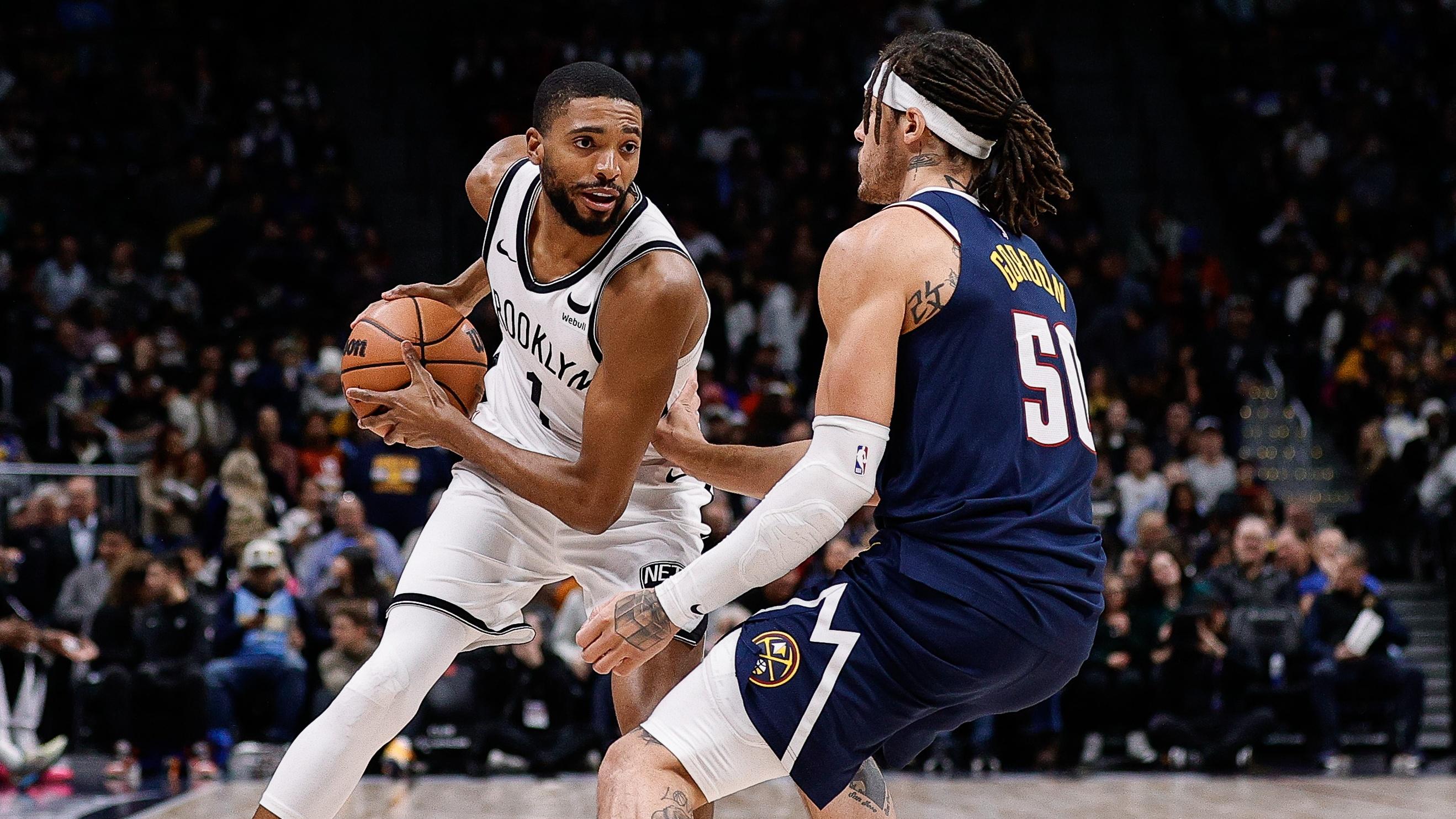 Brooklyn Nets forward Mikal Bridges (1) controls the ball as Denver Nuggets forward Aaron Gordon (50) guards in the first quarter at Ball Arena / Isaiah J. Downing - USA TODAY Sports