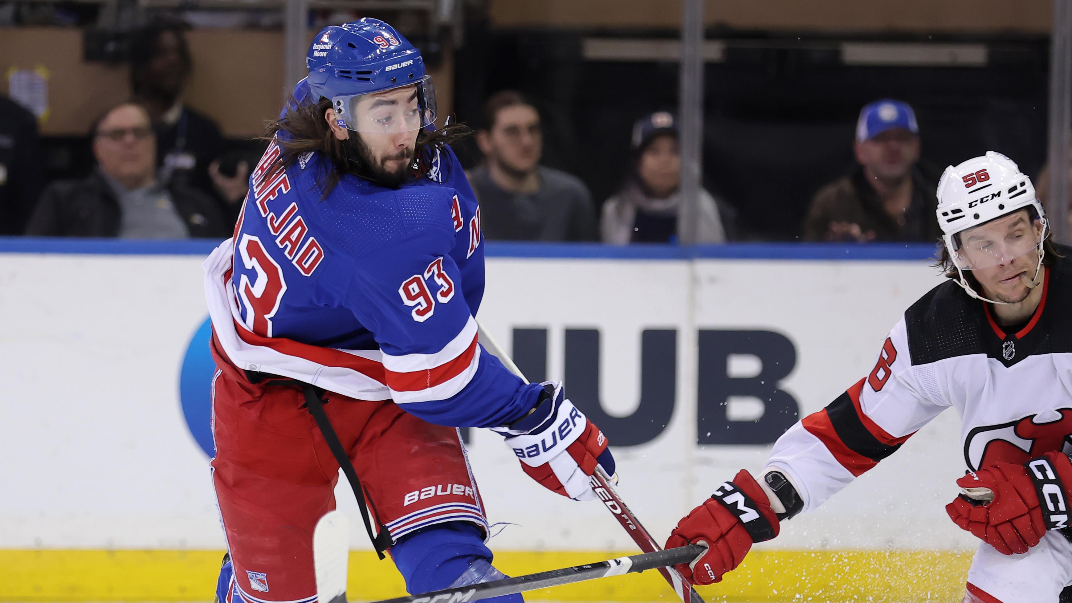 Mar 11, 2024; New York, New York, USA; New York Rangers center Mika Zibanejad (93) follows through on a shot against New Jersey Devils left wing Erik Haula (56) during the third period at Madison Square Garden. / Brad Penner-USA TODAY Sports