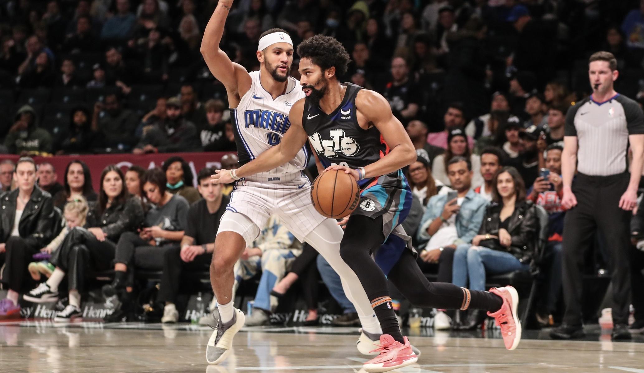 Brooklyn Nets guard Spencer Dinwiddie (26) looks to drive past Orlando Magic guard Jalen Suggs (4) in the second quarter at Barclays Center. / Wendell Cruz-USA TODAY Sports