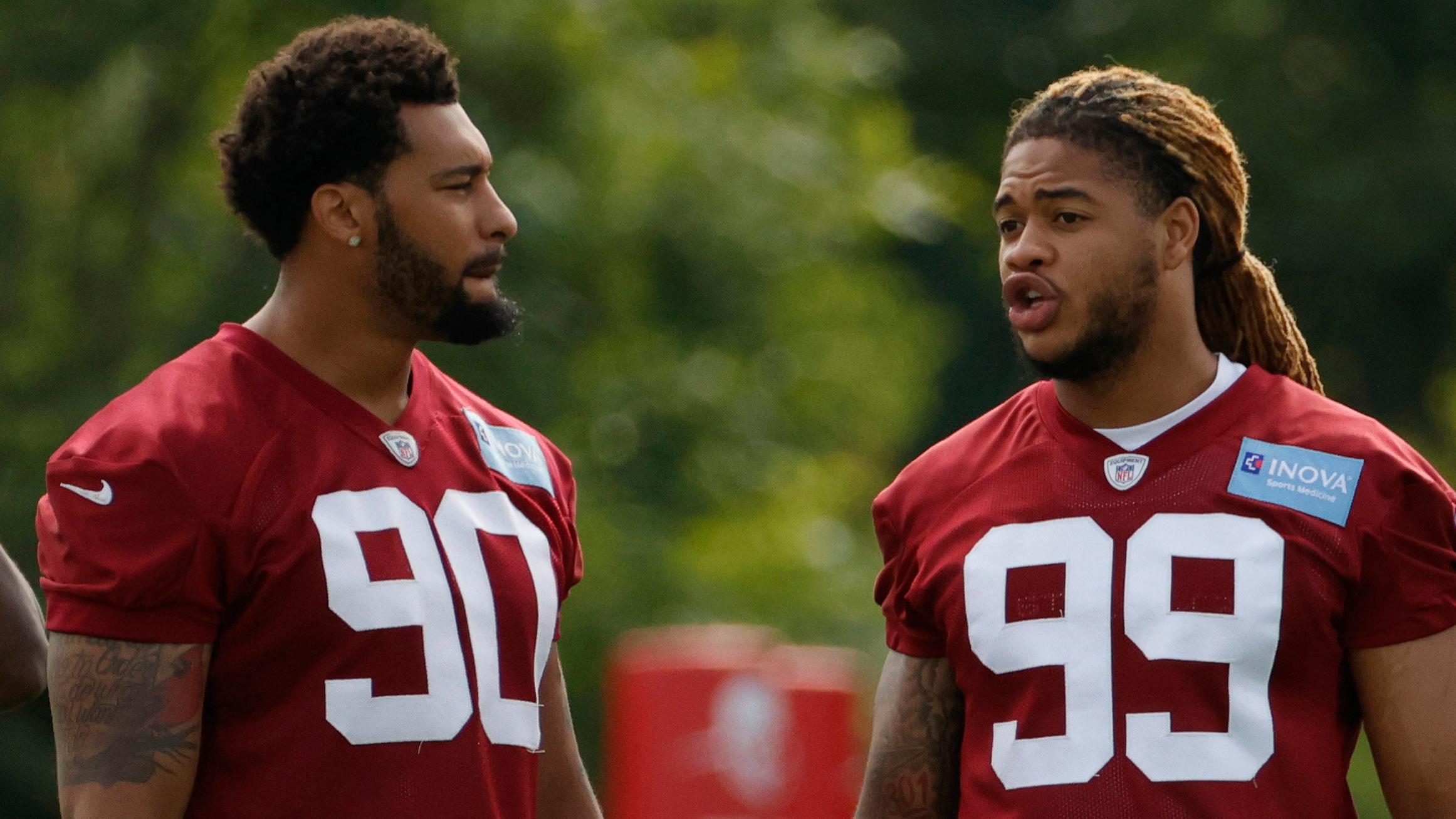 Washington Football Team defensive end Montez Sweat (90) talks with Washington Football Team defensive end Chase Young (99) prior to drills as part of minicamp at Inova Sports Performance Center. / Geoff Burke - USA TODAY Sports