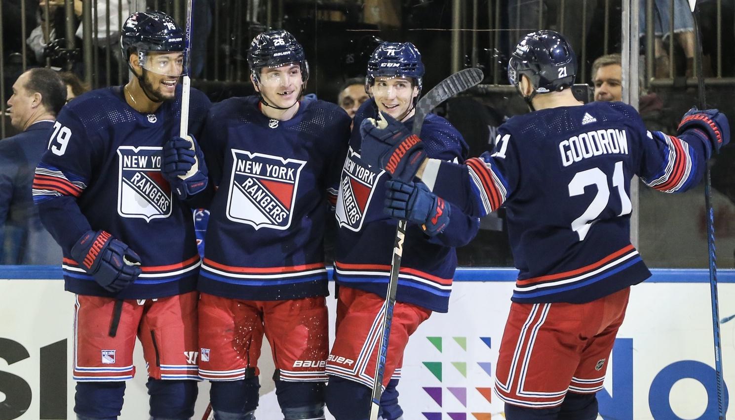 New York Rangers left wing Jimmy Vesey (26) celebrates with his teammates after scoring a goal in the second period against the Tampa Bay Lightning at Madison Square Garden. / Wendell Cruz-USA TODAY Sports