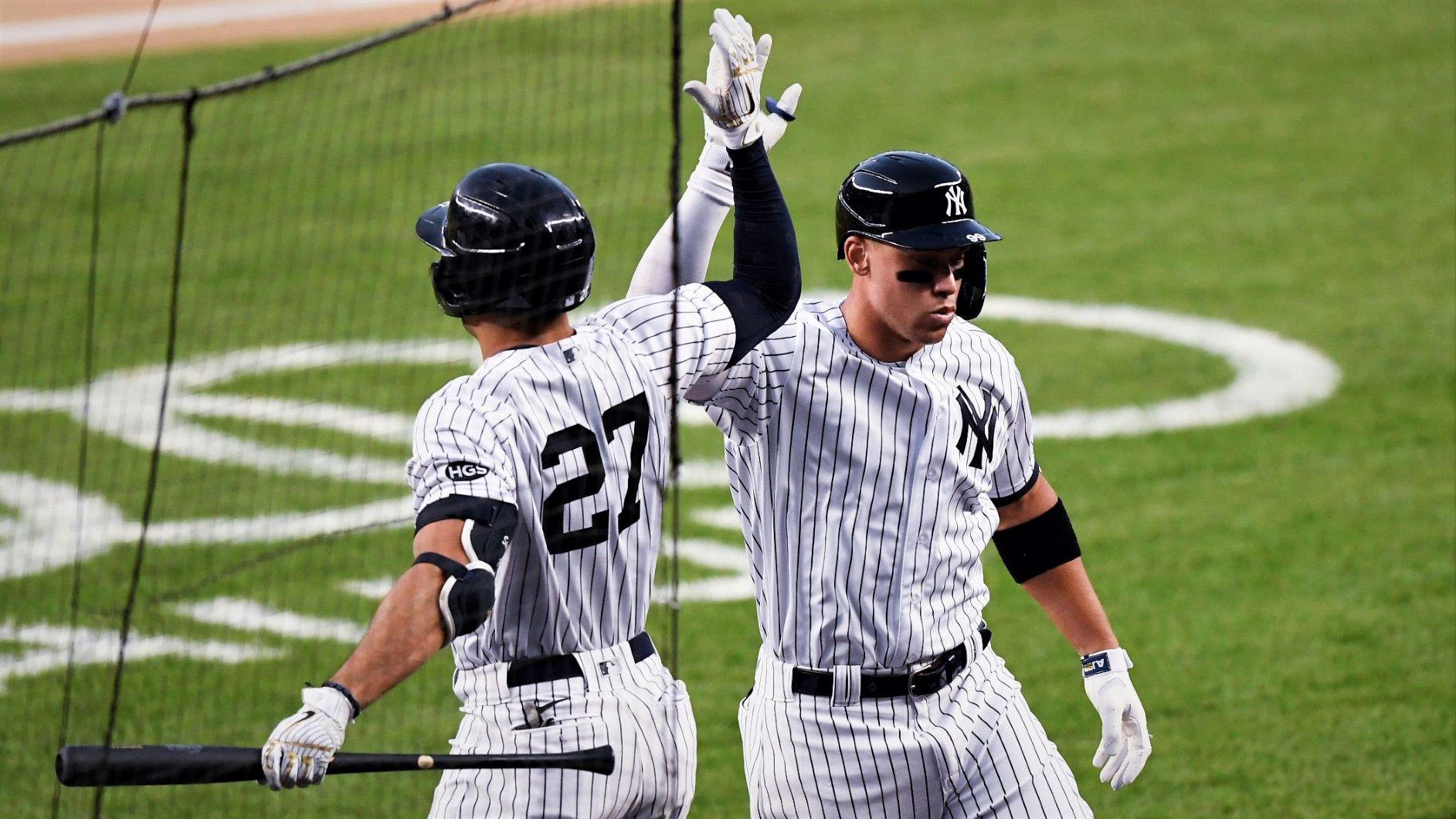 New York Yankees right fielder Aaron Judge (99) celebrates with Giancarlo Stanton (27) after Judge's two-run homer in the third inning. The Yankees host the Boston Red Sox in their home opener at Yankee Stadium on Friday, July 31, 2020, in New York. Yanks Home Opener / © Danielle Parhizkaran/NorthJersey.com via Imagn Content Services, LLC