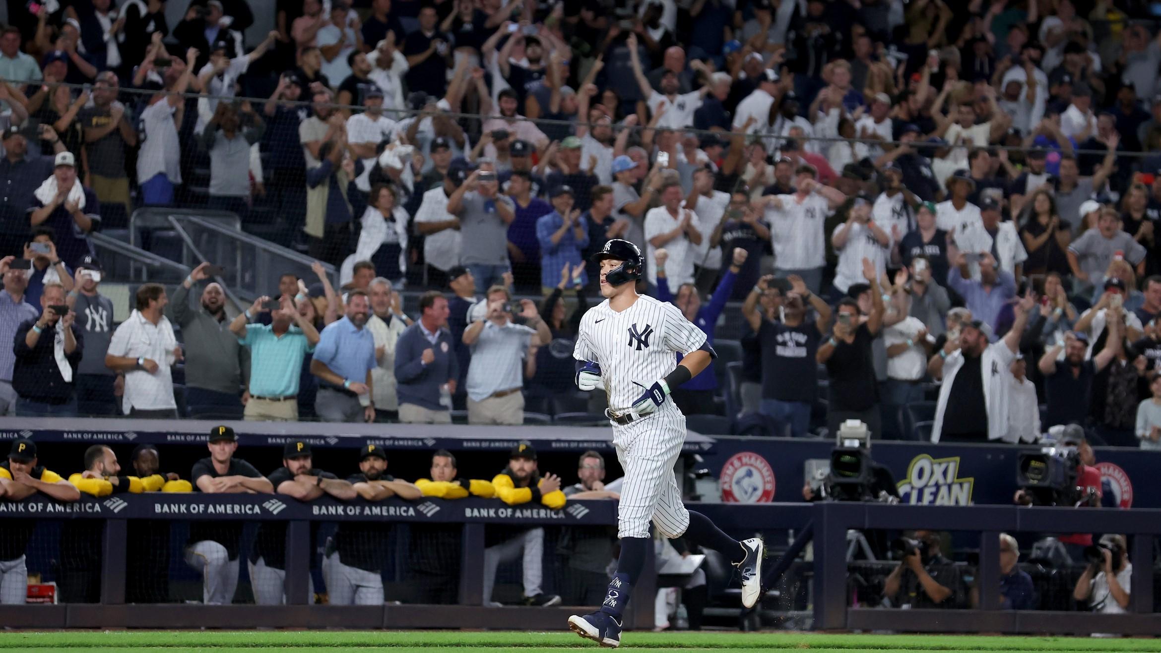 Yankees right fielder Aaron Judge (99) rounds the bases after hitting his 60th home run of the season during the ninth inning against the Pittsburgh Pirates at Yankee Stadium. / Brad Penner-USA TODAY Sports
