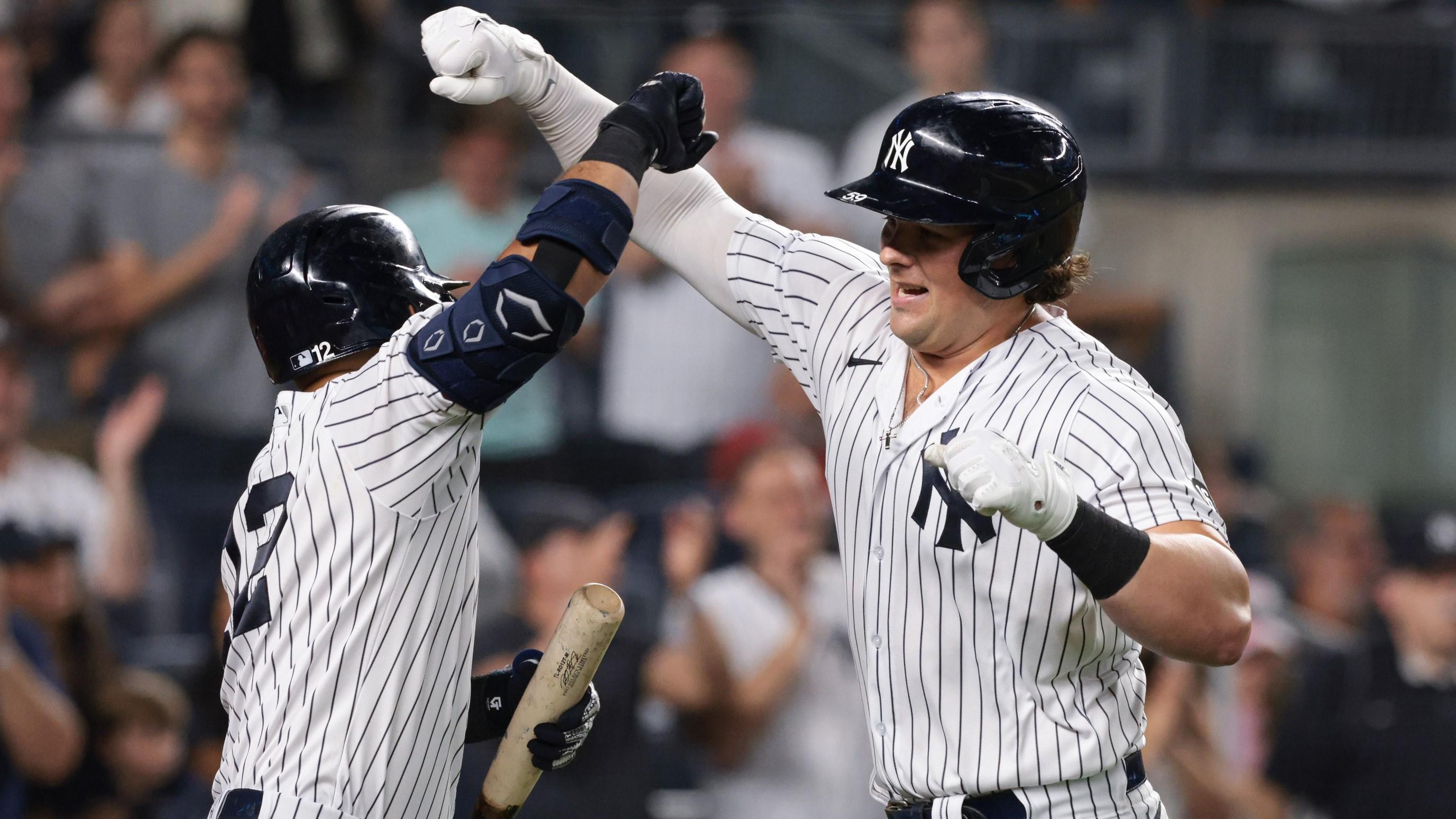 Aug 20, 2021; Bronx, New York, USA; New York Yankees first baseman Luke Voit (59) celebrates with second baseman Rougned Odor (12) after hitting a solo home run during the seventh inning against the Minnesota Twins at Yankee Stadium. / Vincent Carchietta-USA TODAY Sports