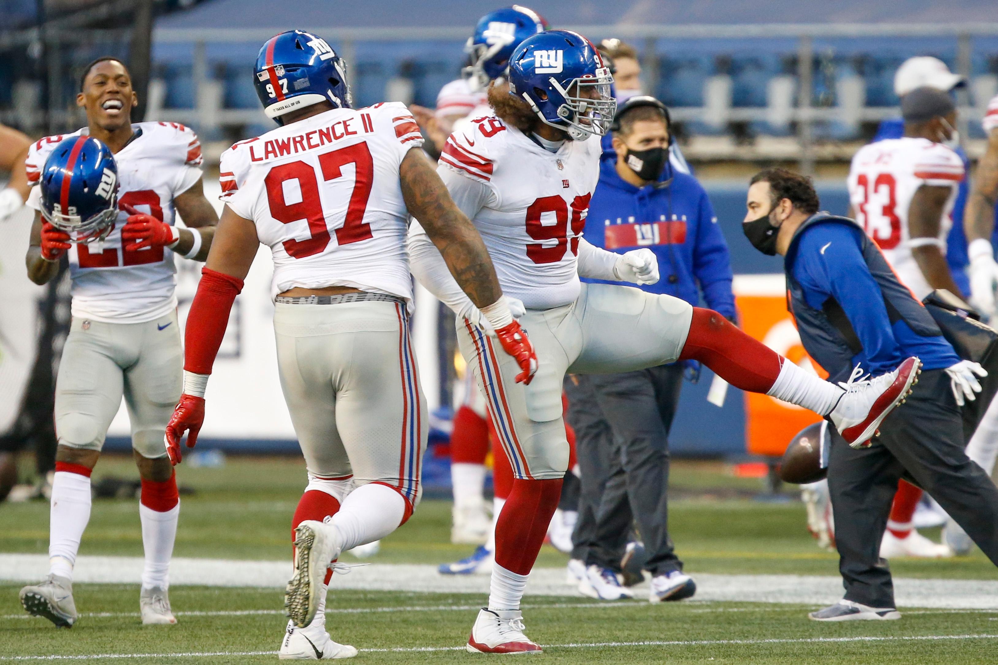 Dec 6, 2020; Seattle, Washington, USA; New York Giants defensive end Leonard Williams (99) celebrates following a fourth down stop against the Seattle Seahawks during the fourth quarter at Lumen Field. / Joe Nicholson-USA TODAY Sports