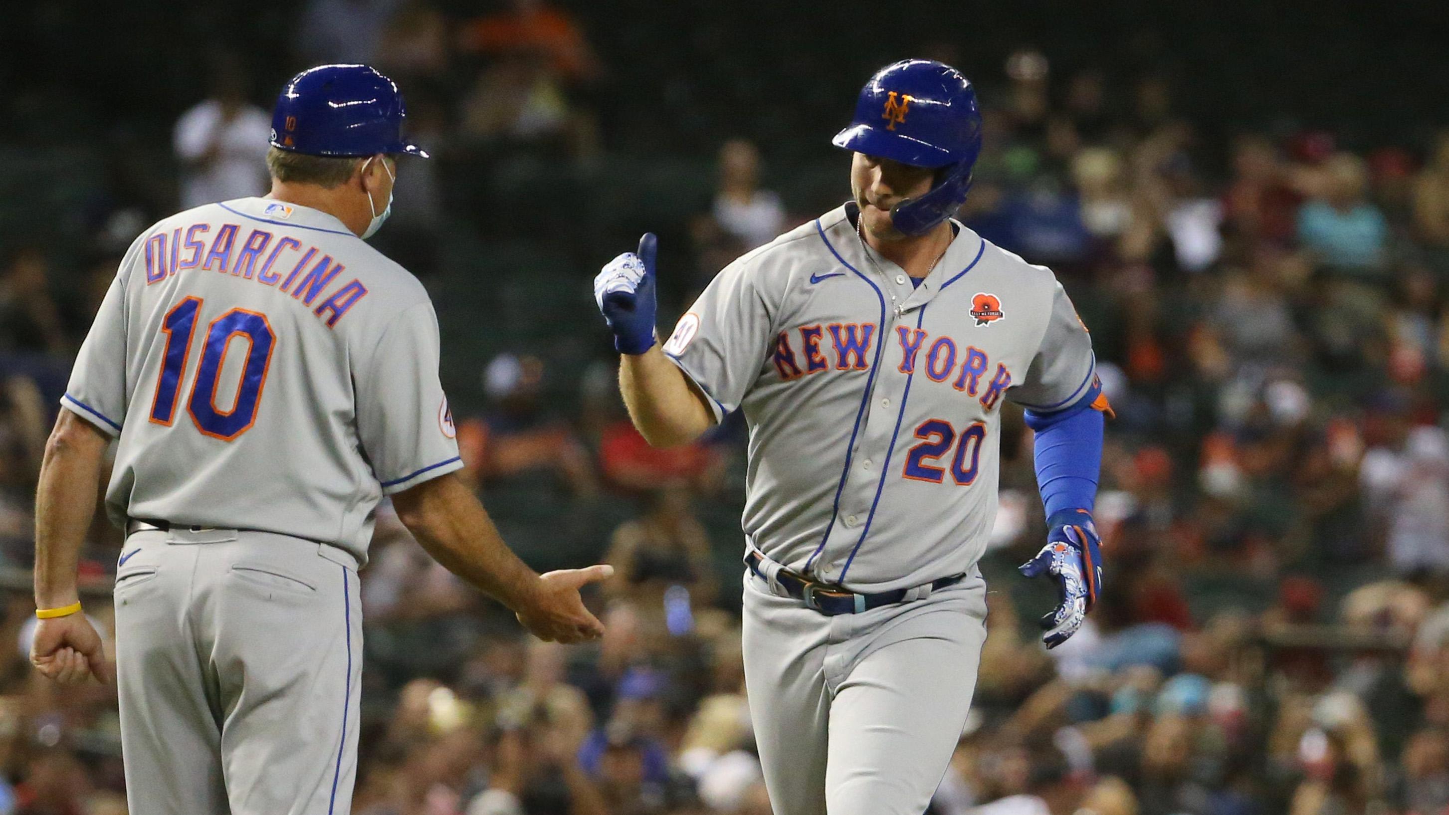 New York Mets' Pete Alonso (20) is congratulated by third base coach Gary Disarcina (10) after hitting a two-run home run against the Arizona Diamondbacks during the seventh inning at Chase Field May 31, 2021. Mets Vs Diamondbacks / Michael Chow/The Republic via Imagn Content Services, LLC