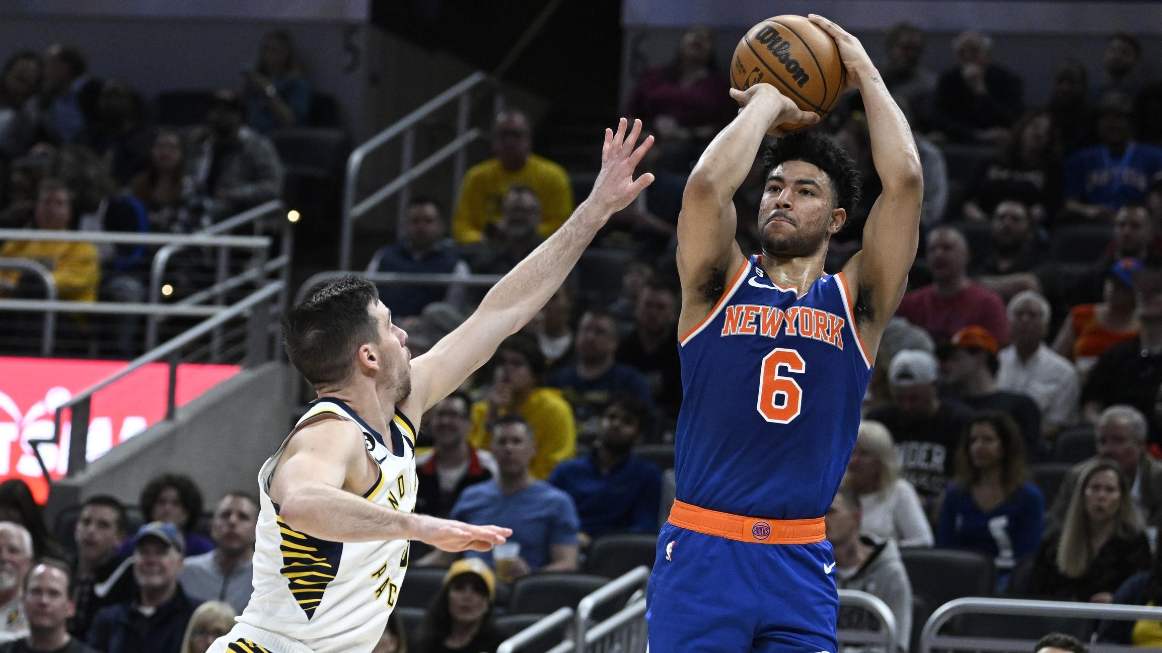 Apr 5, 2023; Indianapolis, Indiana, USA; New York Knicks guard Quentin Grimes (6) shoots over Indiana Pacers guard T.J. McConnell (9) during the first half at Gainbridge Fieldhouse. / Marc Lebryk-USA TODAY Sports