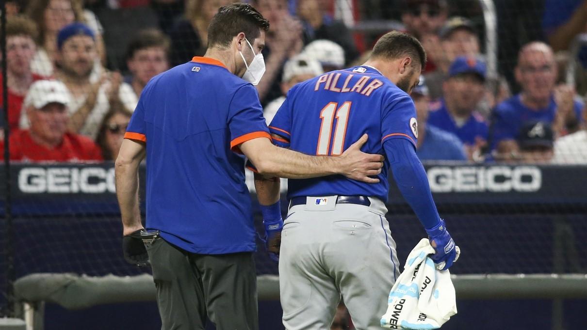 May 17, 2021; Atlanta, Georgia, USA; New York Mets center fielder Kevin Pillar (11) is helped off the field after being hit by a pitch against the Atlanta Braves in the seventh inning at Truist Park. / Brett Davis-USA TODAY Sports