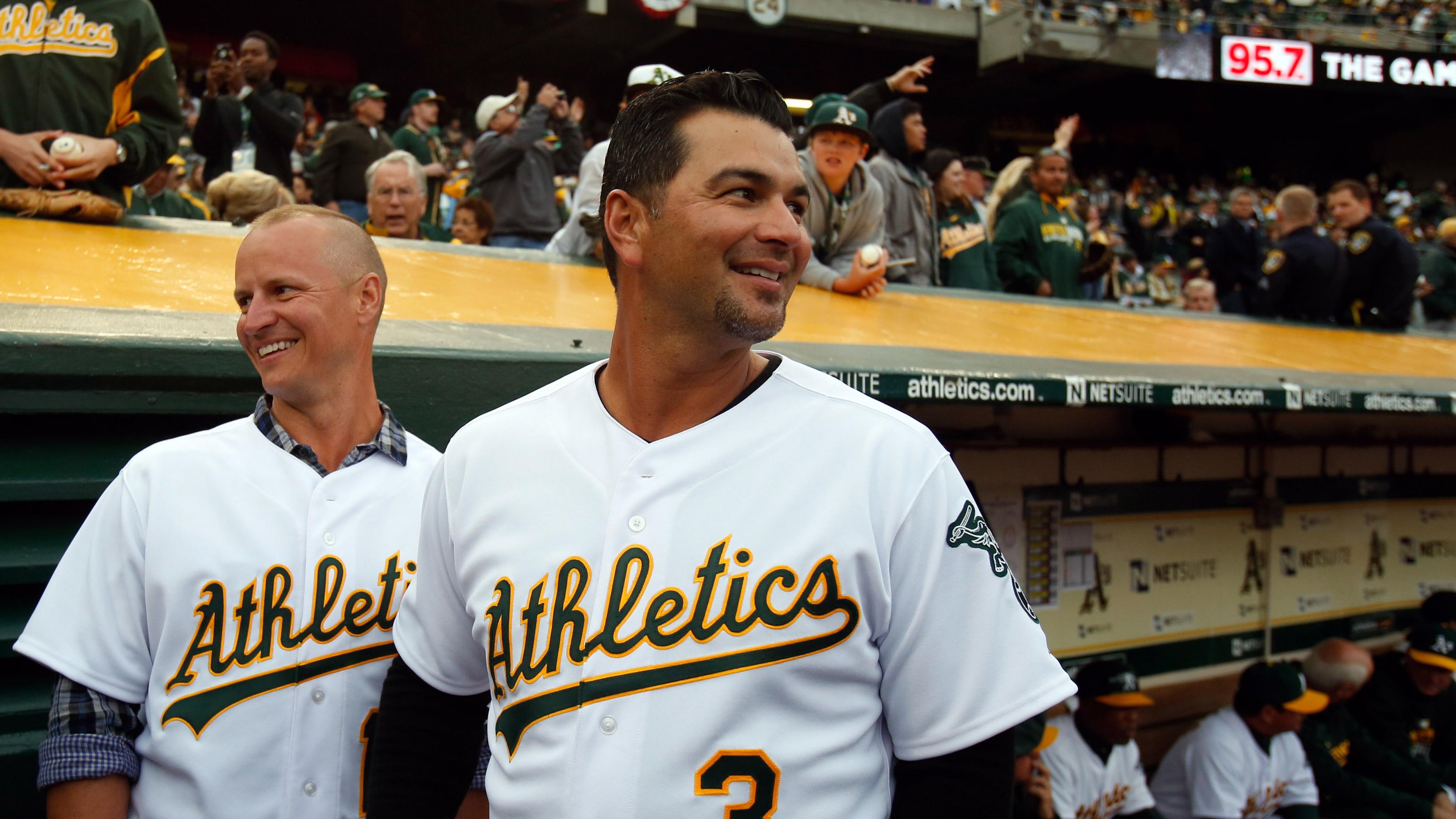 Apr 6, 2015; Oakland, CA, USA; Oakland Athletics former players Mark Ellis and Eric Chavez before the game against the Texas Rangers at O.co Coliseum. / Kelley L Cox-USA TODAY Sports