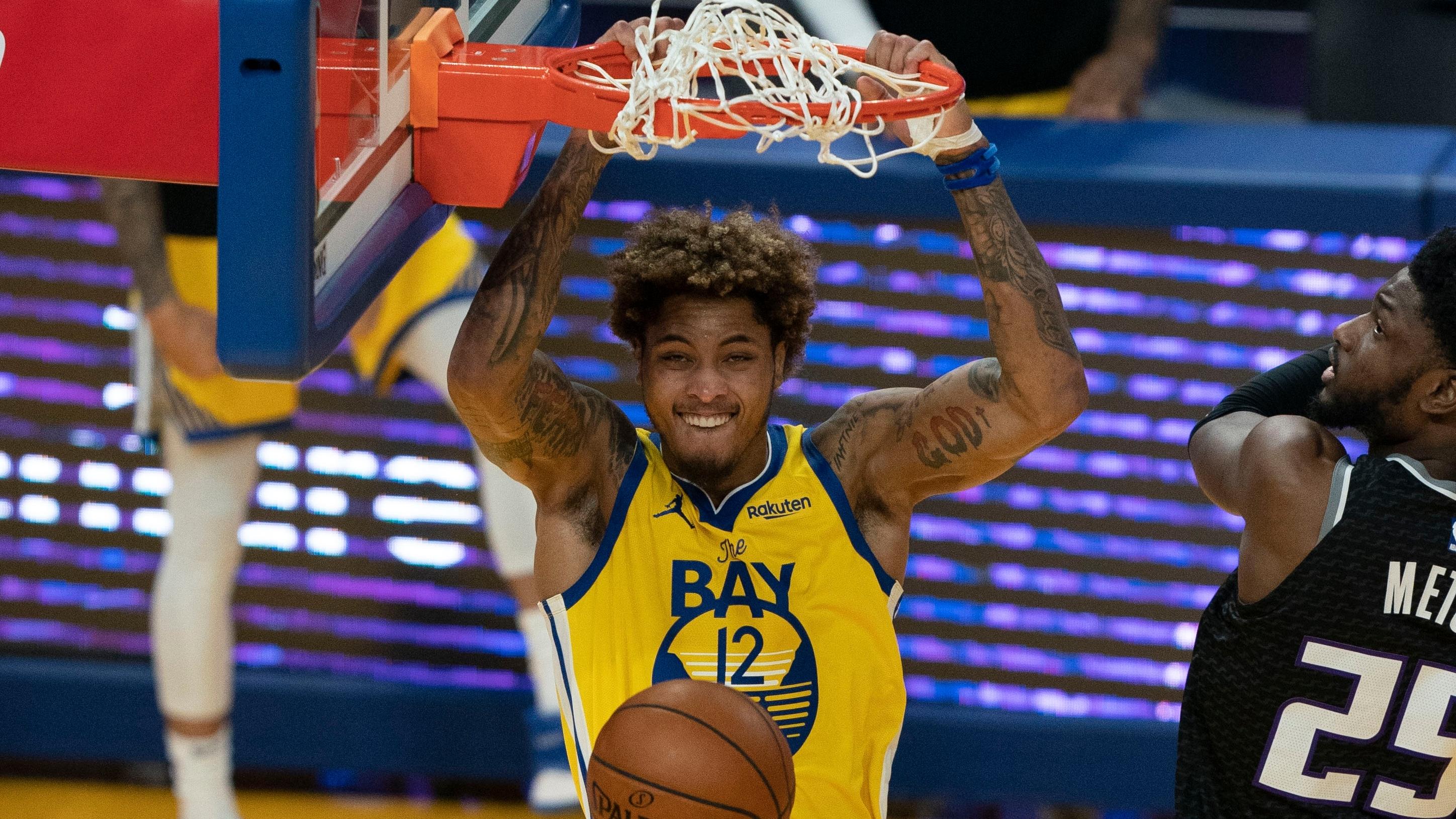 April 25, 2021; San Francisco, California, USA; Golden State Warriors guard Kelly Oubre Jr. (12) dunks the basketball against Sacramento Kings forward Chimezie Metu (25) during the second quarter at Chase Center. / Kyle Terada-USA TODAY Sports