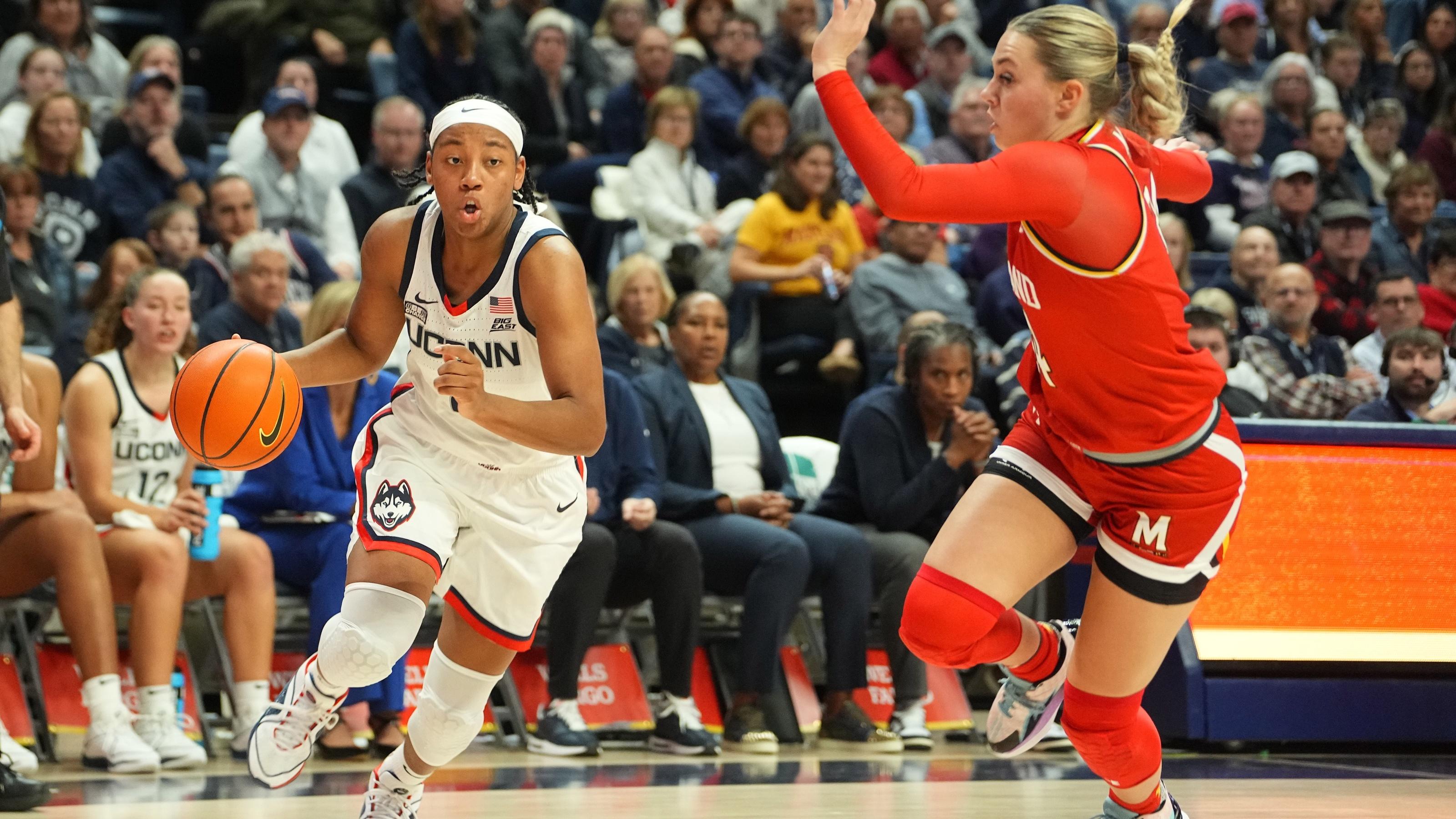 Connecticut Huskies guard KK Arnold (2) dribbles the ball against Maryland Terrapins guard Emily Fisher (34) during the second half at Harry A. Gampel Pavilion. / Gregory Fisher-USA TODAY Sports