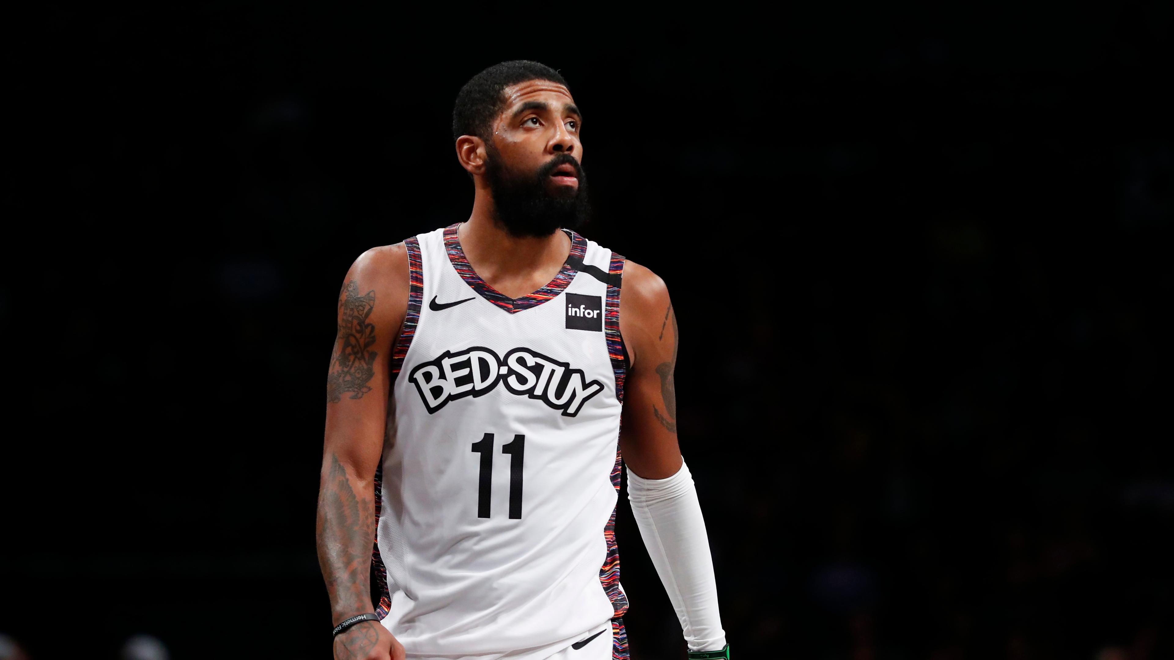Kyrie Irving wearing white Bedstuy jersey / Noah K. Murray/USA TODAY