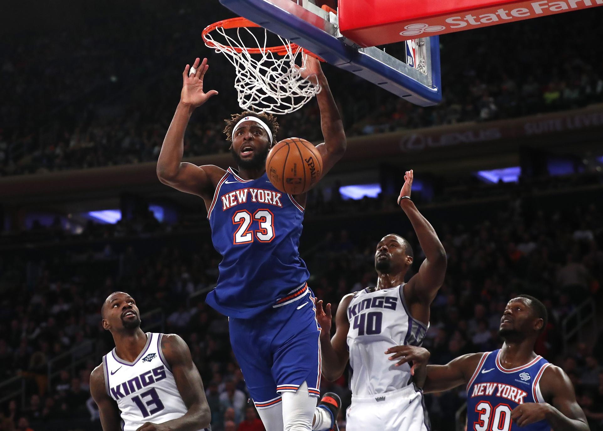 Nov 3, 2019; New York, NY, USA; New York Knicks center Mitchell Robinson (23) scores a basket against the Sacramento Kings during the second half at Madison Square Garden. / Noah K. Murray/USA TODAY Sports