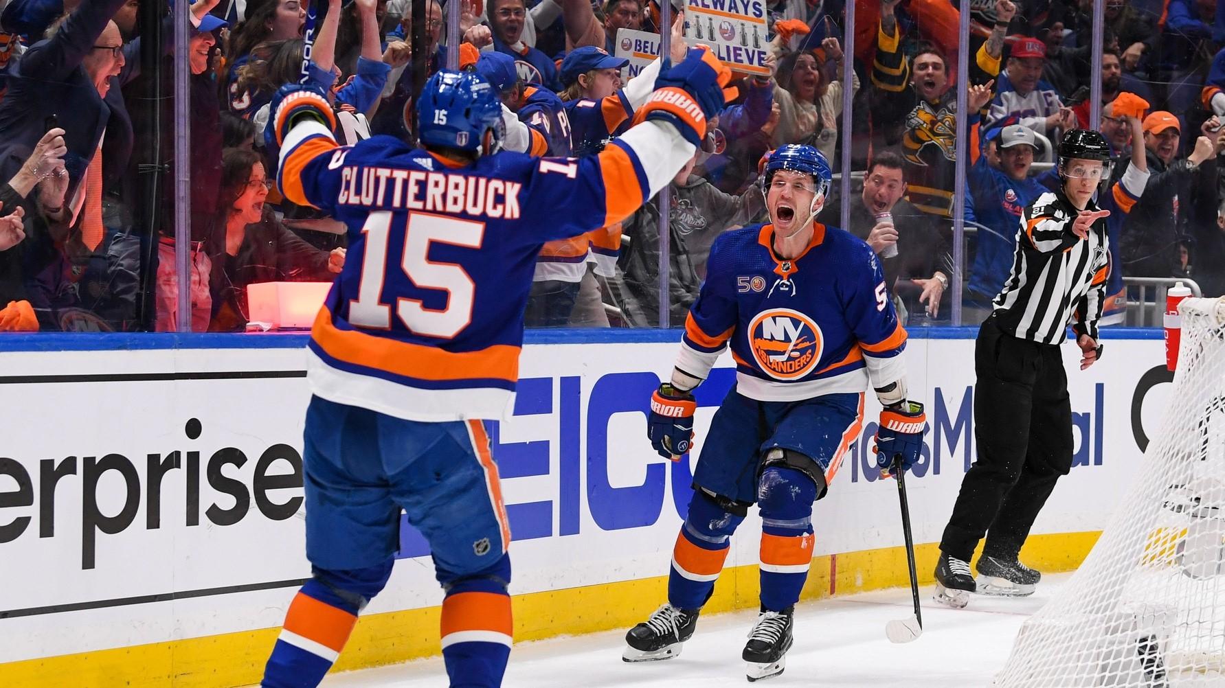 Apr 21, 2023; Elmont, New York, USA; New York Islanders center Casey Cizikas (53) celebrates his goal with right wing Cal Clutterbuck (15) against the Carolina Hurricanes during the second period in game three of the first round of the 2023 Stanley Cup Playoffs at UBS Arena. / Dennis Schneidler-USA TODAY Sports