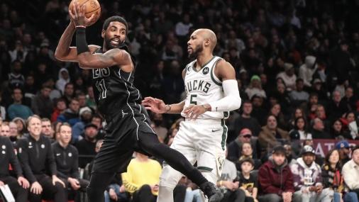Brooklyn, New York, USA; Brooklyn Nets guard Kyrie Irving (11) is guarded by Milwaukee Bucks guard Jevon Carter (5) in the second quarter at Barclays Center / Wendell Cruz - USA TODAY Sports
