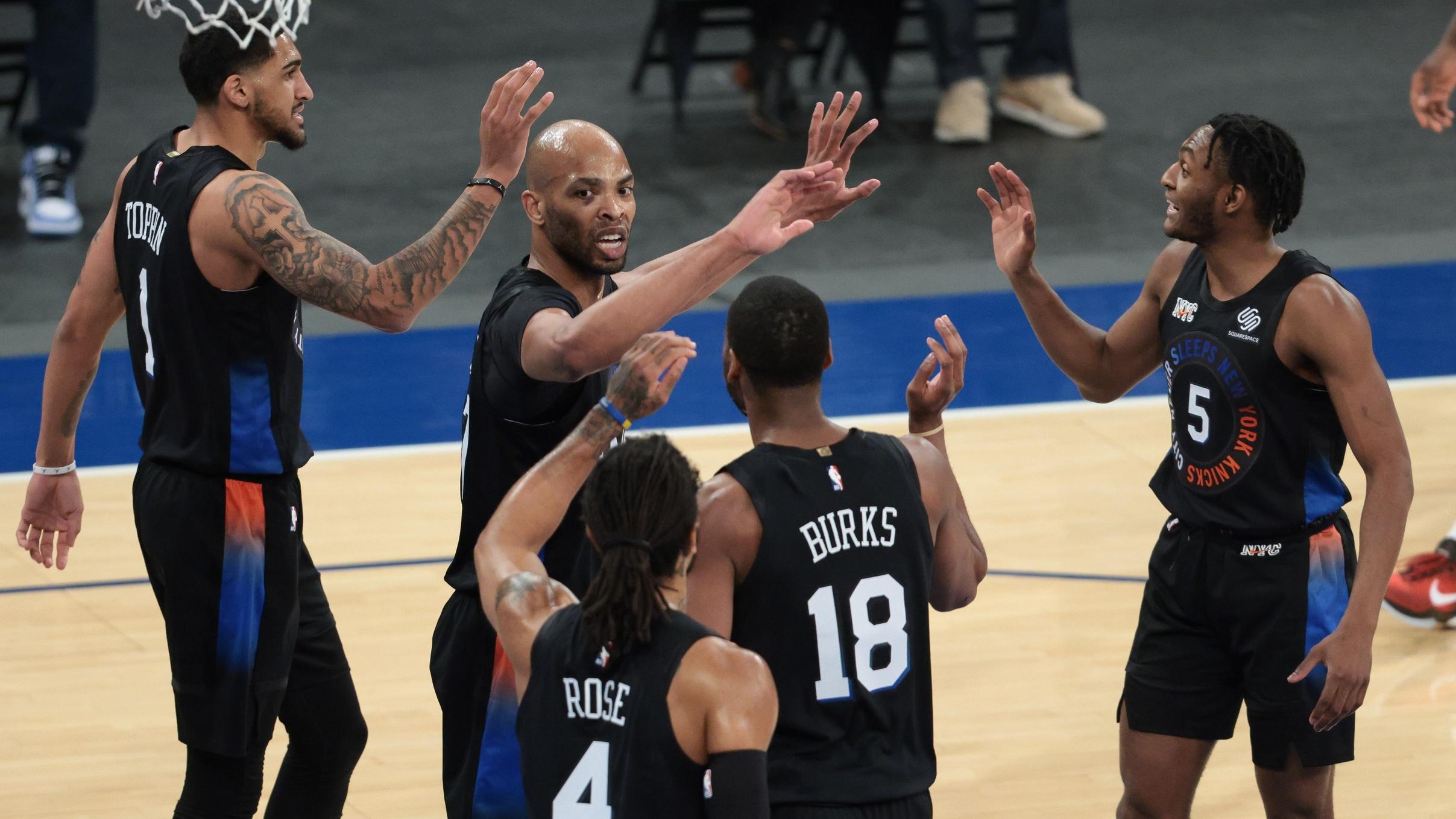 Apr 2, 2021; New York, New York, USA; New York Knicks center Taj Gibson (67) high fives with teammates after blocking a shot during the first half against the Dallas Mavericks at Madison Square Garden. / Vincent Carchietta-USA TODAY Sports