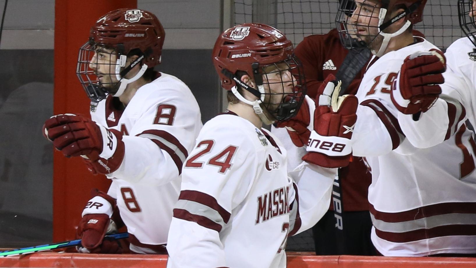 UMass Minutemen defenseman Zac Jones (24) celebrates his goal with the bench during the first period in the semifinals of the 2021 Frozen Four NCAA hockey tournament against the Minnesota Duluth / Charles LeClaire-USA TODAY Sports