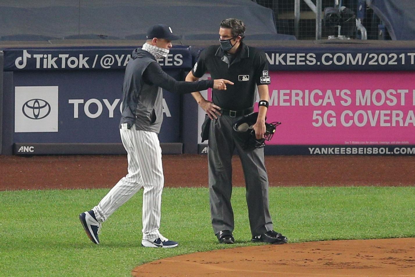 Sep 25, 2020; Bronx, New York, USA; New York Yankees manager Aaron Boone argues with home plate umpire John Tumpane (74) during the first inning against the Miami Marlins at Yankee Stadium. Mandatory Credit: Brad Penner-USA TODAY Sports / © Brad Penner-USA TODAY Sports