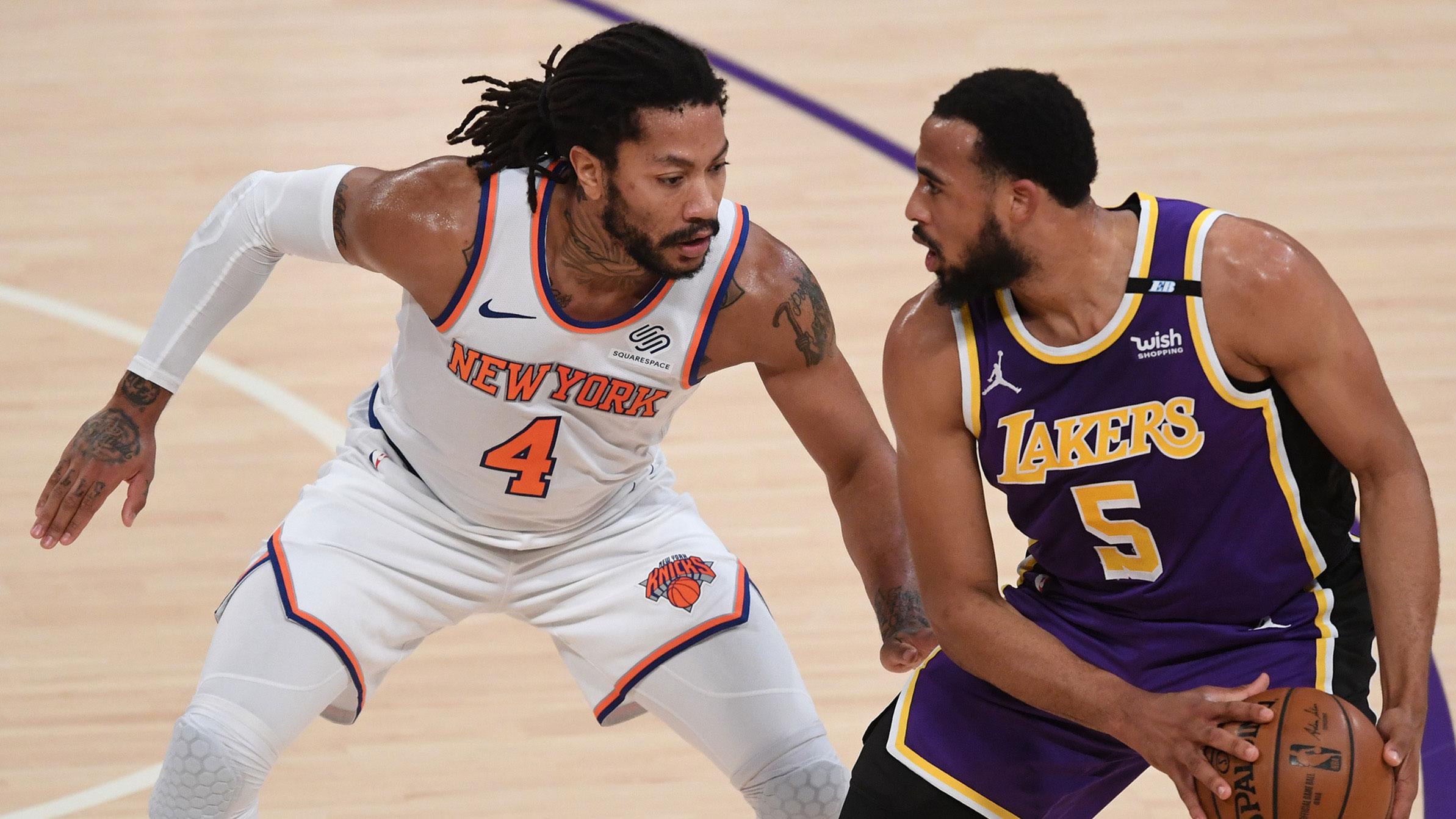 May 11, 2021; Los Angeles, California, USA; New York Knicks guard Derrick Rose (4) defends Los Angeles Lakers guard Talen Horton-Tucker (5) in the first half of the game at Staples Center. / Jayne Kamin-Oncea-USA TODAY Sports
