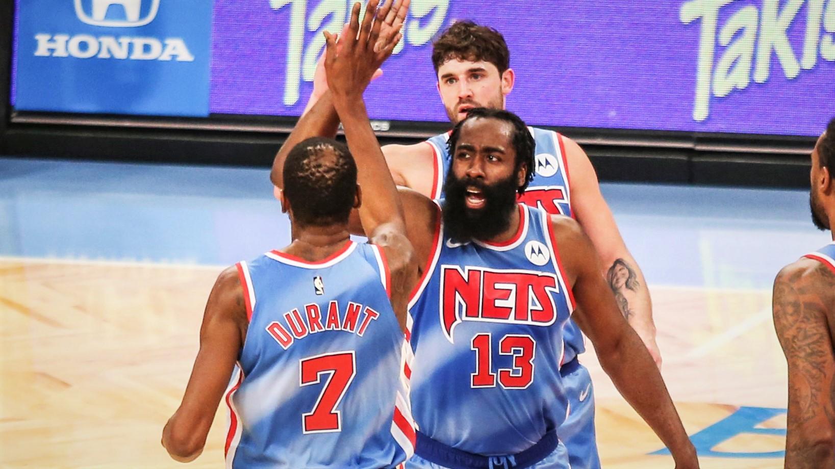 Jan 16, 2021; Brooklyn, New York, USA; Brooklyn Nets guard James Harden (13) high fives forward Kevin Durant (7) during a time out in the second quarter against the Orlando Magic at Barclays Center. / Wendell Cruz-USA TODAY Sports