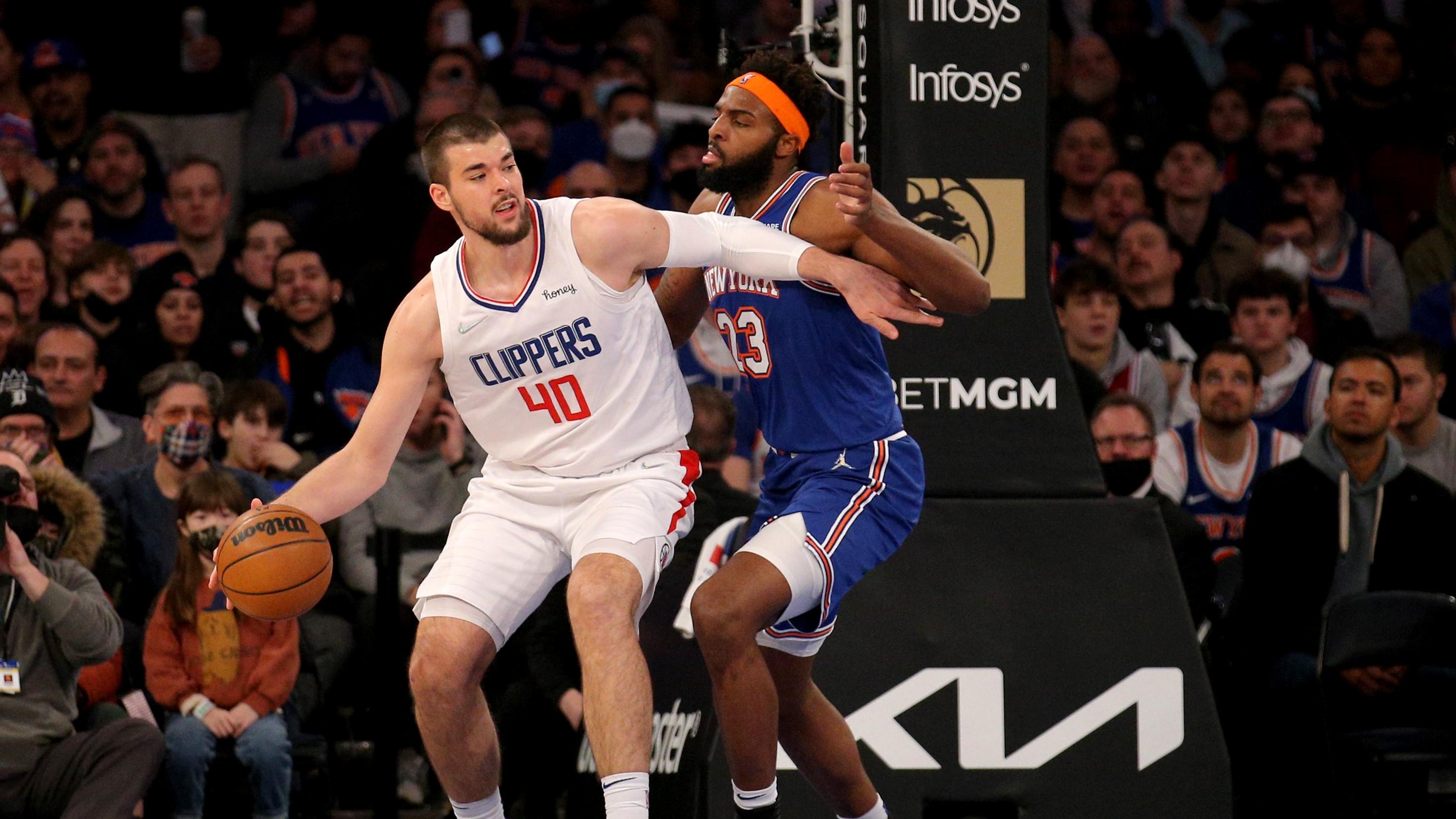 Jan 23, 2022; New York, New York, USA; Los Angeles Clippers center Ivica Zubac (40) controls the ball against New York Knicks center Mitchell Robinson (23) during the first quarter at Madison Square Garden. / Brad Penner-USA TODAY Sports
