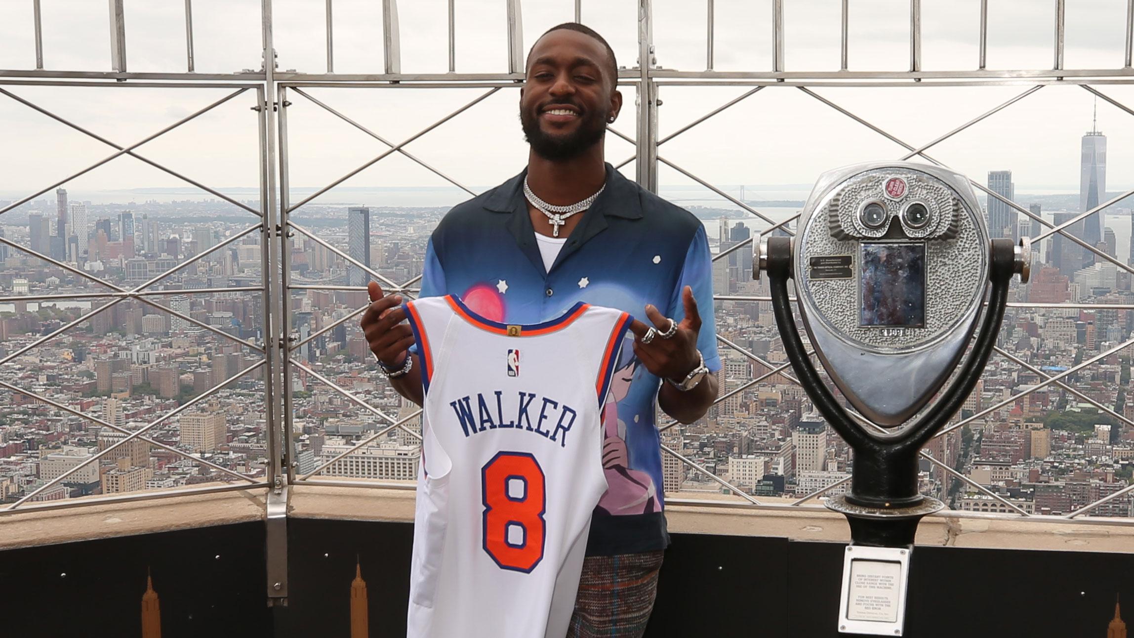 Aug 17, 2021; New York, New York, USA; New York Knicks guard Kemba Walker (8) poses for a photo during a photo shoot on the 86th floor observation deck of the Empire State Building. / Brad Penner-USA TODAY Sports