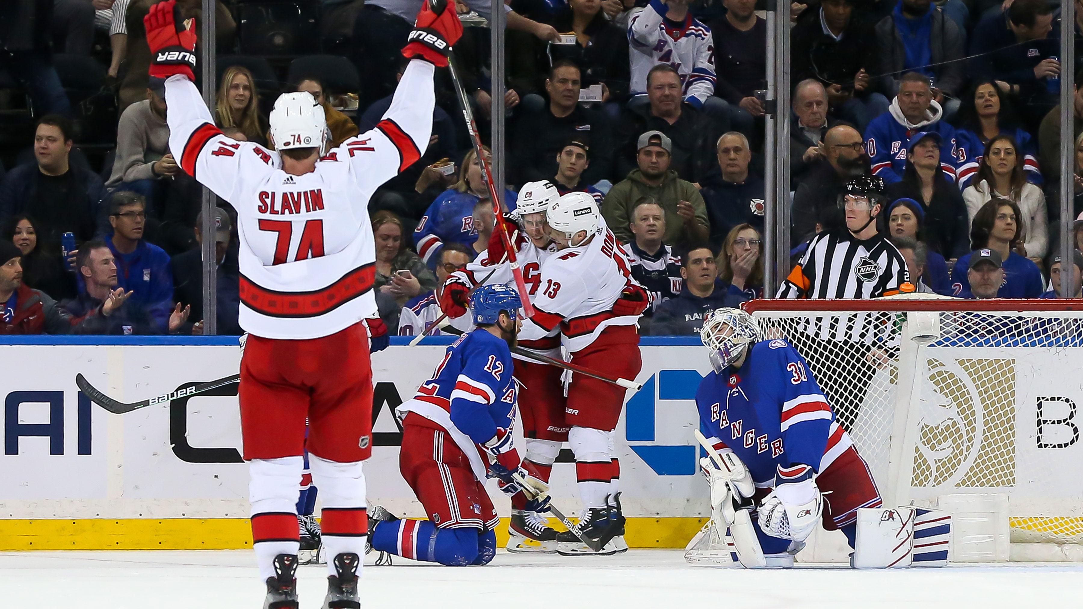 Apr 26, 2022; New York, New York, USA; Carolina Hurricanes left wing Teuvo Teravainen (86) celebrates with Carolina Hurricanes center Max Domi (13) after scoring a goal against New York Rangers during the second period at Madison Square Garden. / Tom Horak-USA TODAY Sports