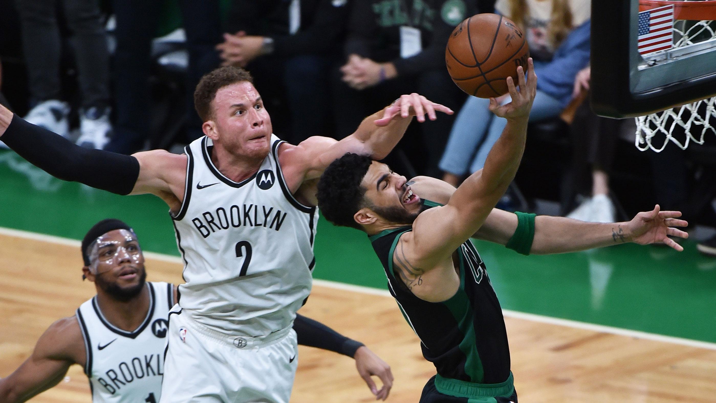 May 28, 2021; Boston, Massachusetts, USA; Boston Celtics forward Jayson Tatum (0) drives to the basket past Brooklyn Nets forward Blake Griffin (2) during the first half during game three in the first round of the 2021 NBA Playoffs at TD Garden. / Bob DeChiara-USA TODAY Sports