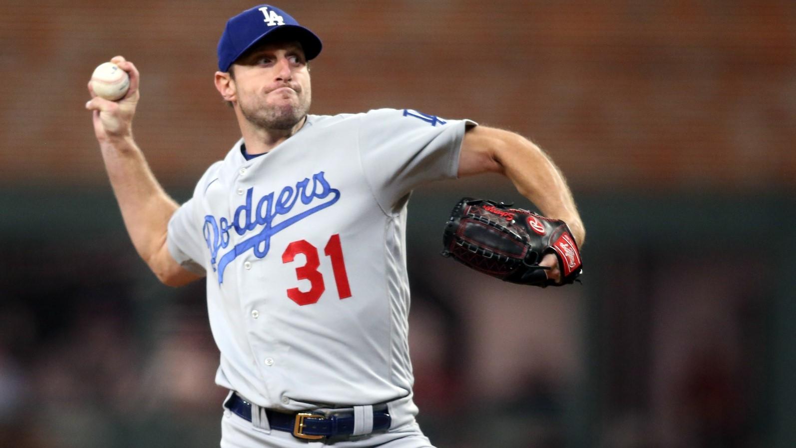 Oct 17, 2021; Cumberland, Georgia, USA; Los Angeles Dodgers starting pitcher Max Scherzer (31) pitching against the Atlanta Braves during the first inning in game two of the 2021 NLCS at Truist Park. / Brett Davis-USA TODAY Sports