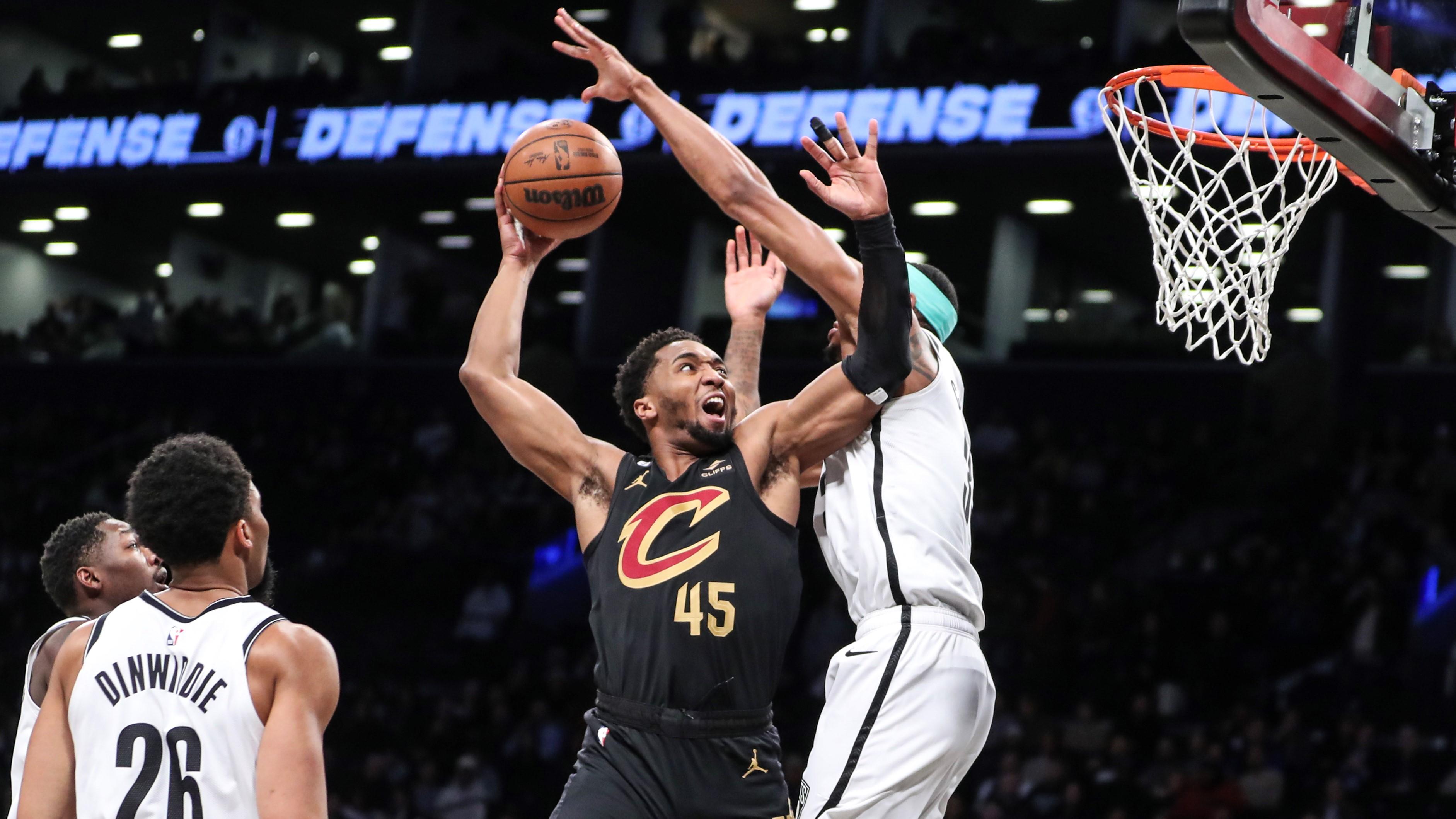 Mar 23, 2023; Brooklyn, New York, USA; Cleveland Cavaliers guard Donovan Mitchell (45) goes up against Brooklyn Nets center Nic Claxton (33) in the first quarter at Barclays Center. Mandatory Credit: Wendell Cruz-USA TODAY Sports / © Wendell Cruz-USA TODAY Sports