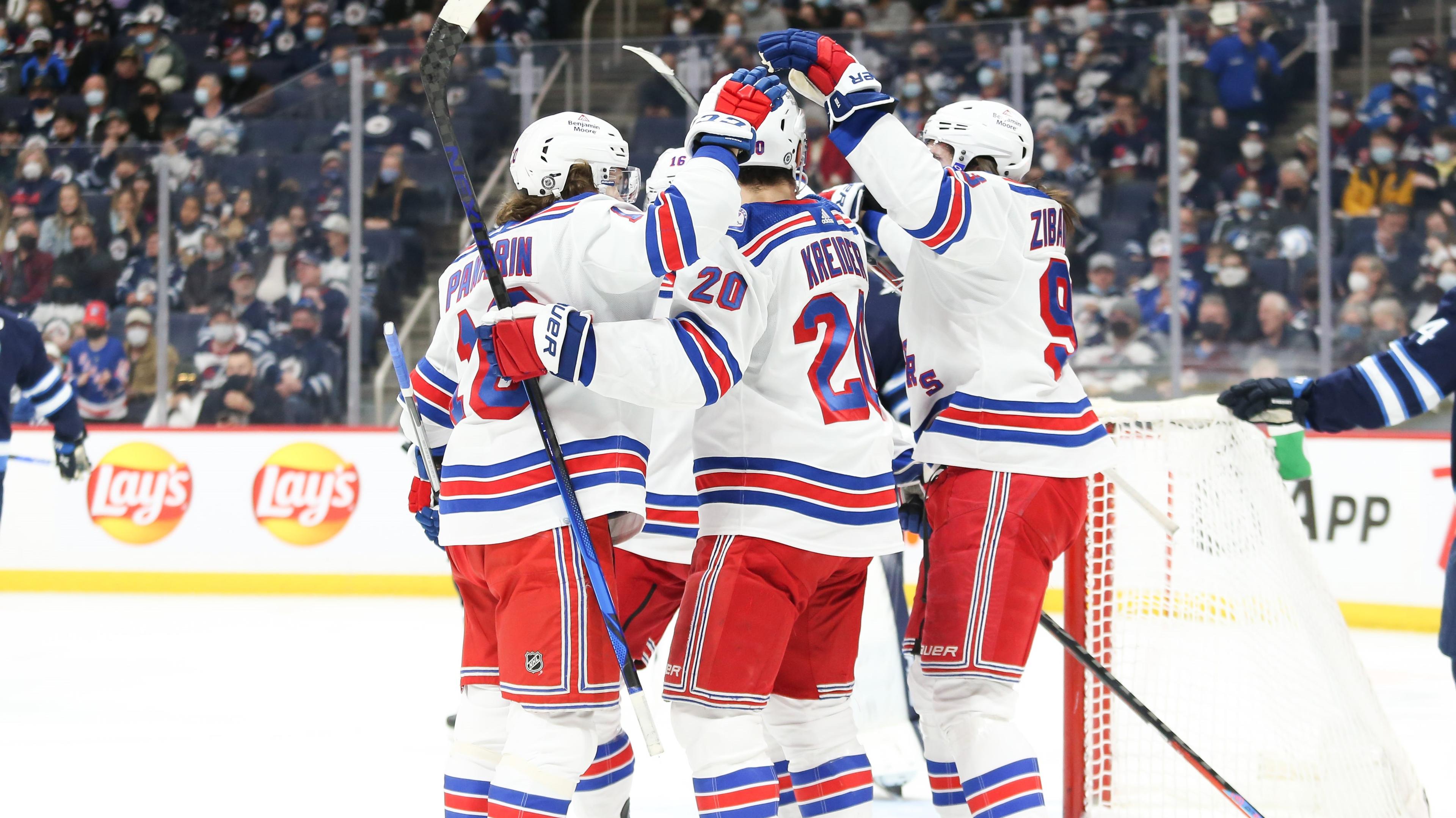 Mar 6, 2022; Winnipeg, Manitoba, CAN; New York Rangers forward Chris Kreider (20) is congratulated by his team mates after his goal against the Winnipeg Jets during the first period at Canada Life Centre. Mandatory Credit: Terrence Lee-USA TODAY Sports / Terrence Lee-USA TODAY Sports