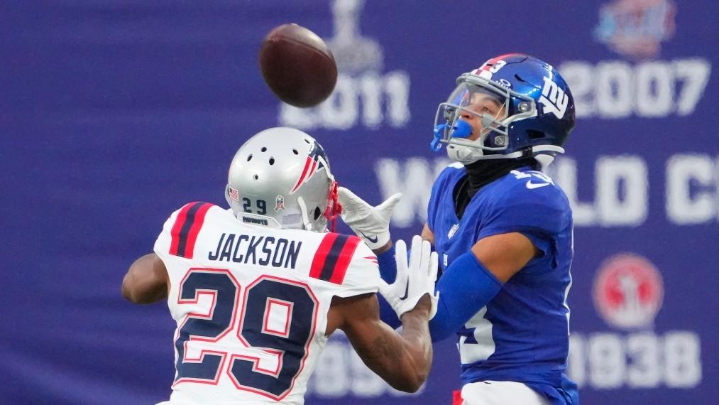 New York Giants wide receiver Jalin Hyatt (13) hauls in a 3rd quarter first down catch as New England Patriots cornerback J.C. Jackson (29) defends at MetLife Stadium. / Robert Deutsch-USA TODAY Sports