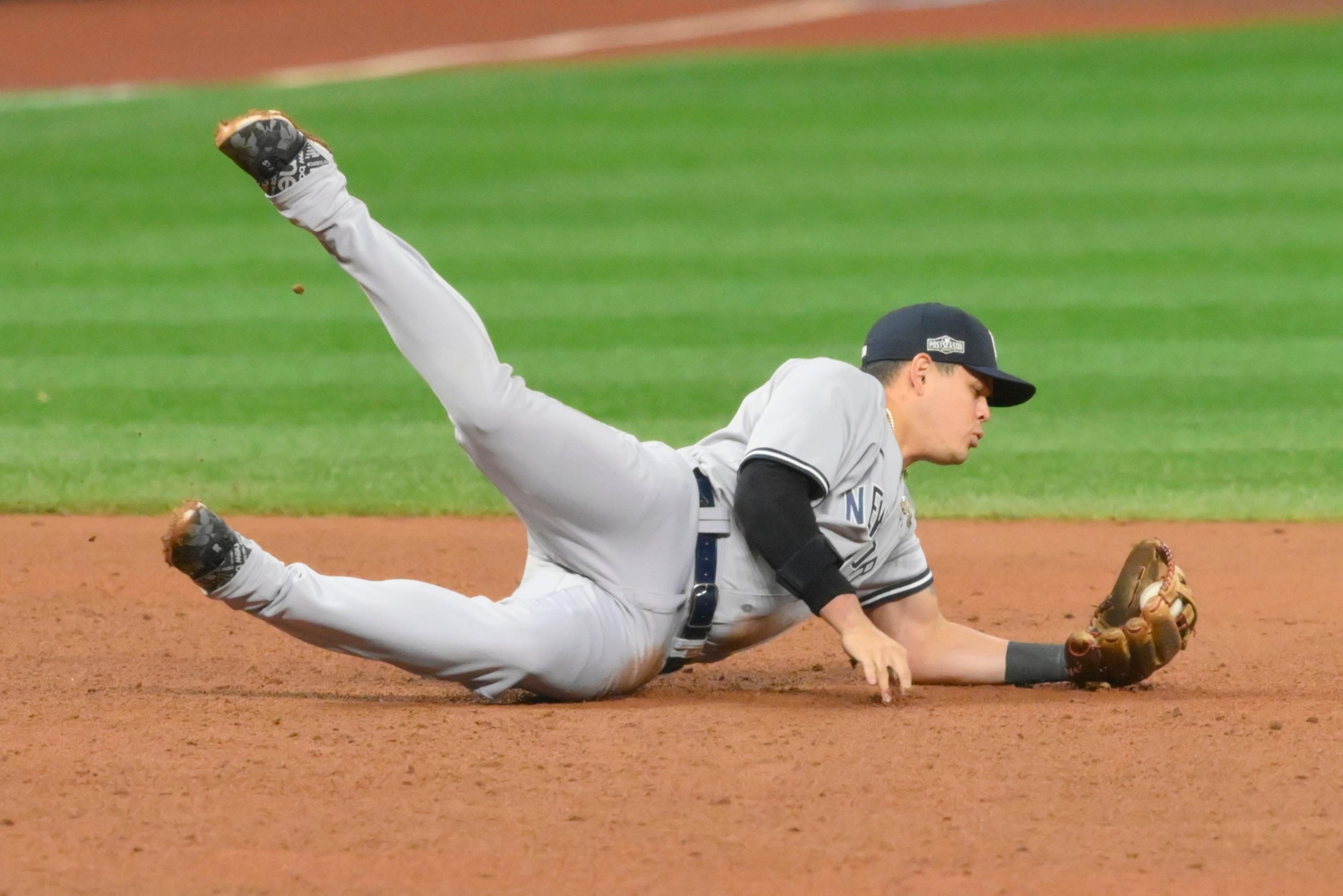 Sep 30, 2020; Cleveland, Ohio, USA; New York Yankees third baseman Gio Urshela (29) makes a diving stop on a ground ball before starting a double play in a the eighth inning against the Cleveland Indians at Progressive Field. Mandatory Credit: David Richard-USA TODAY Sports / © David Richard-USA TODAY Sports