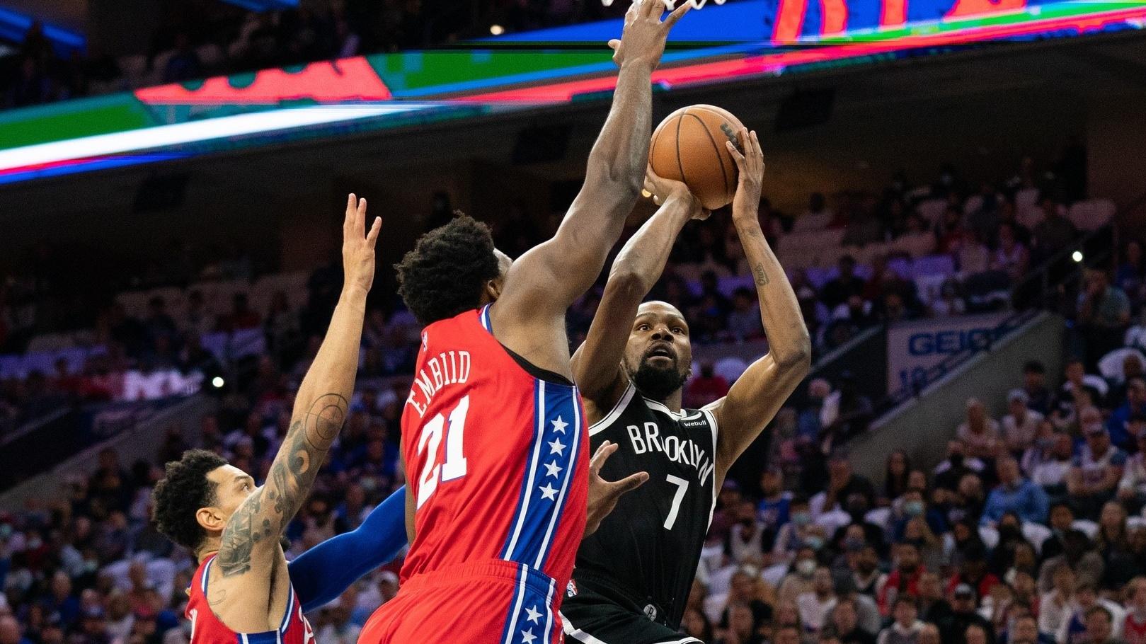 Oct 22, 2021; Philadelphia, Pennsylvania, USA; Brooklyn Nets forward Kevin Durant (7) drives for a shot against Philadelphia 76ers center Joel Embiid (21) during the first quarter at Wells Fargo Center / Bill Streicher-USA TODAY Sports