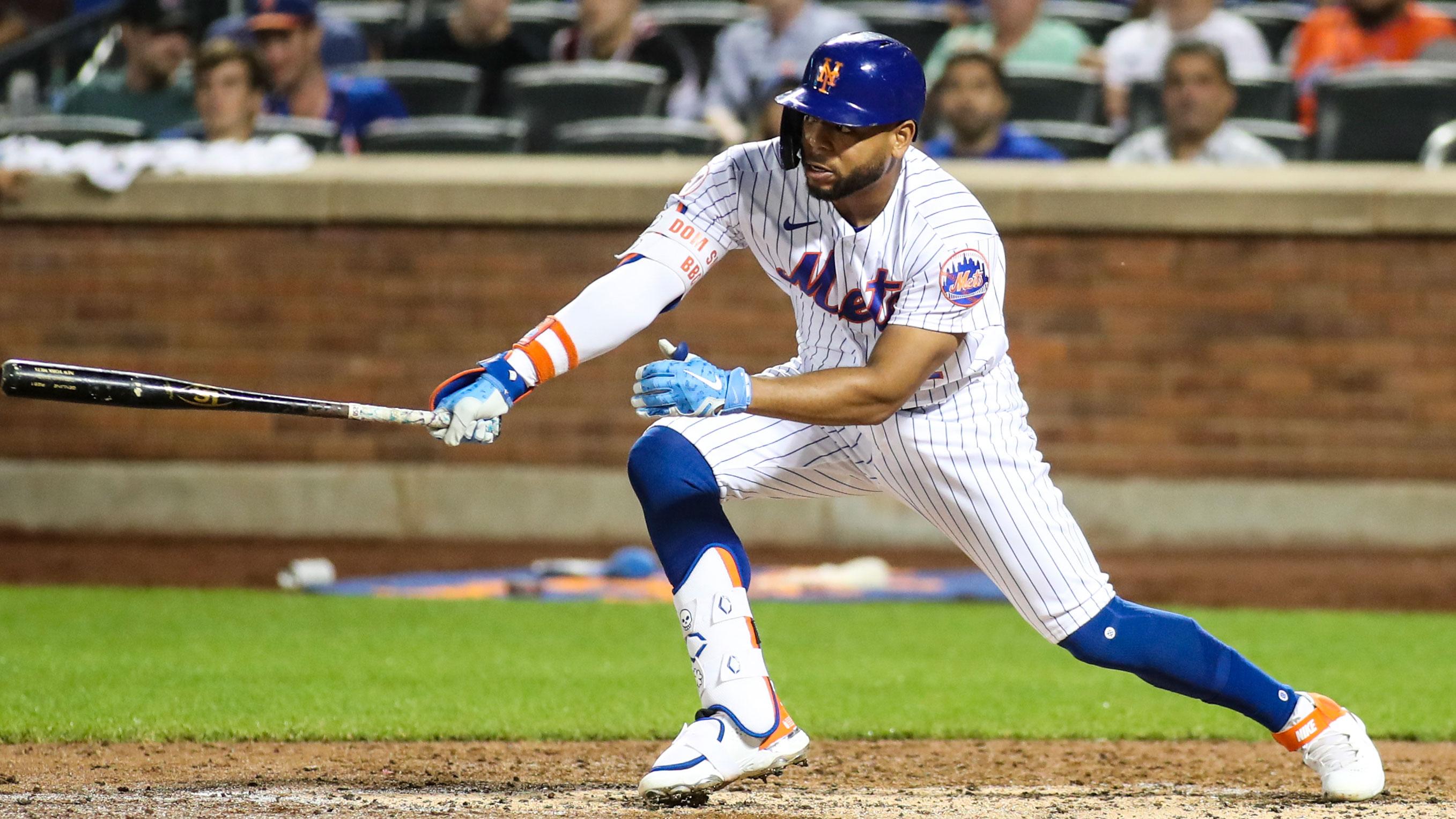 Jun 25, 2021; New York City, New York, USA; New York Mets left fielder Dominic Smith (2) hits a single in the fourth inning against the Philadelphia Phillies at Citi Field. / Wendell Cruz-USA TODAY Sports