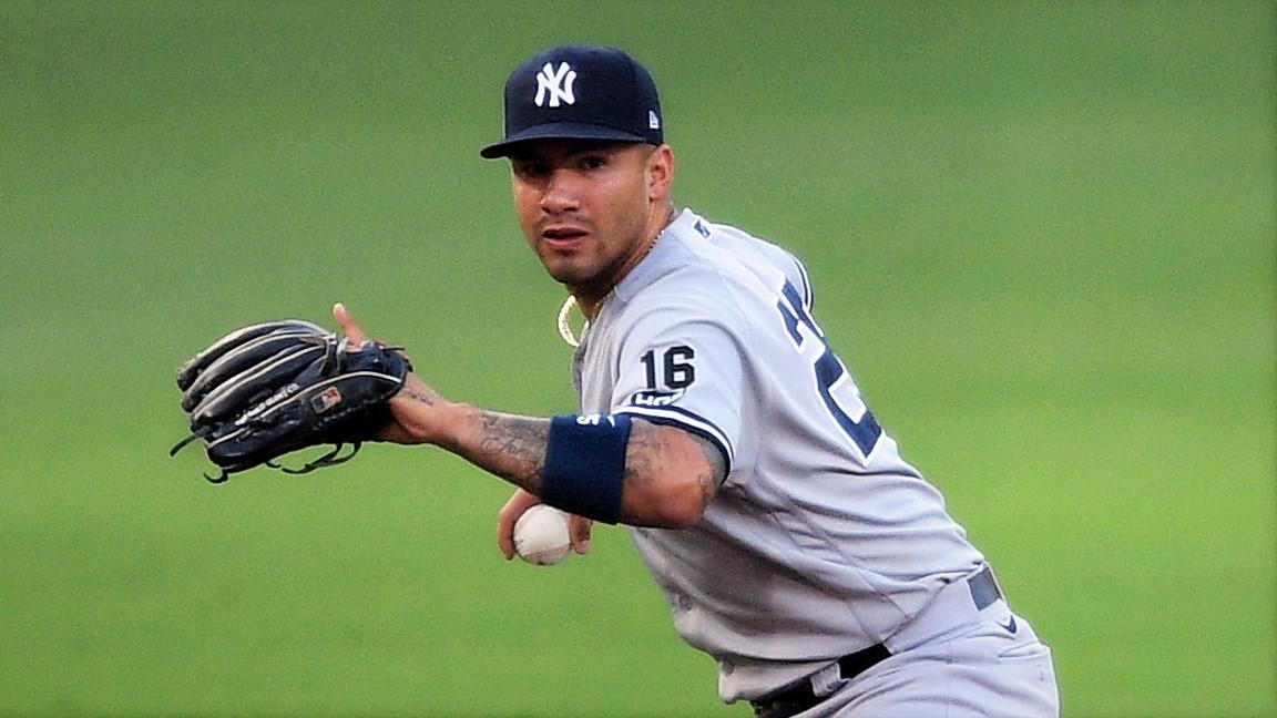 Oct 9, 2020; San Diego, California, USA; New York Yankees shortstop Gleyber Torres (25) holds the ball after being unable to handle a ball hit by Tampa Bay Rays designated hitter Yandy Diaz (not pictured) during the fourth inning of game five of the 2020 ALDS at Petco Park. Torres was charged with an error on the play. / Orlando Ramirez-USA TODAY Sports