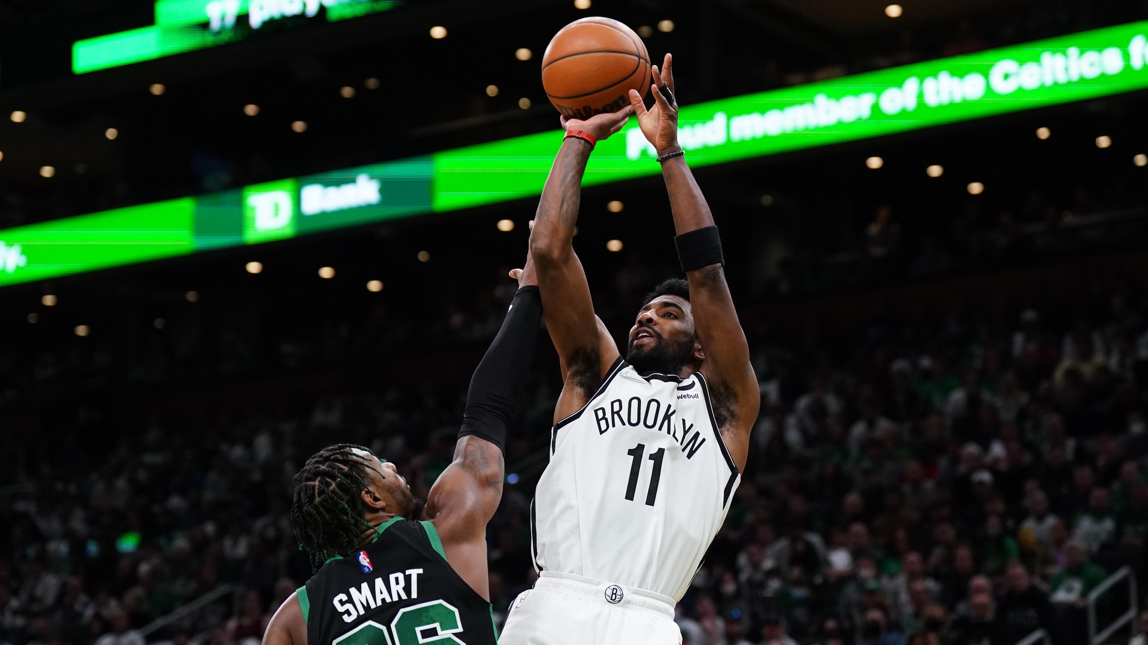 Apr 17, 2022; Boston, Massachusetts, USA; Brooklyn Nets guard Kyrie Irving (11) shoots against Boston Celtics guard Marcus Smart (36) in the first quarter during game one of the first round for the 2022 NBA playoffs at TD Garden. / David Butler II-USA TODAY Sports