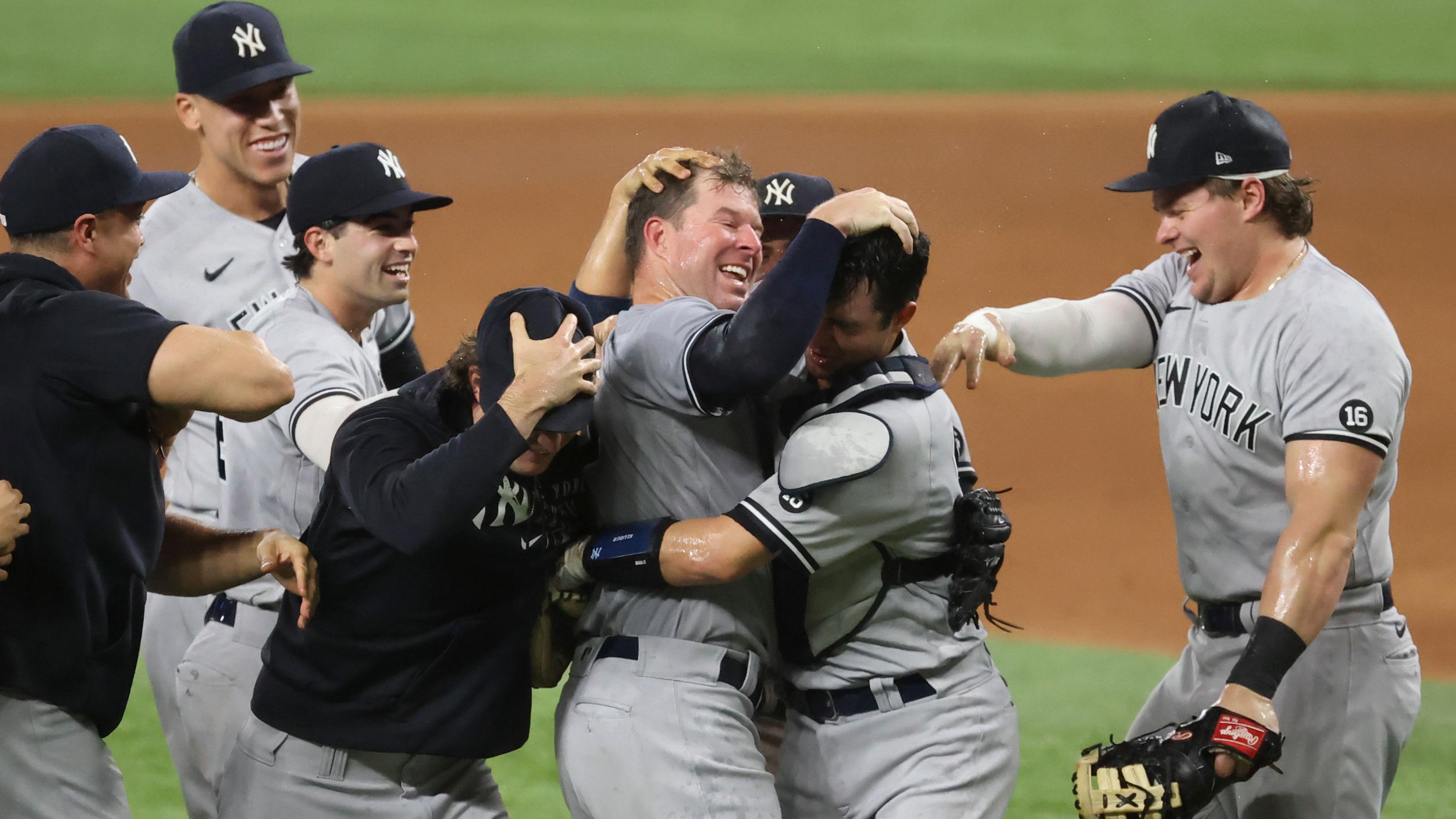 May 19, 2021; Arlington, Texas, USA; New York Yankees starting pitcher Corey Kluber (28) celebrates with teammates after throwing a no-hitter against the Texas Rangers at Globe Life Field. / Kevin Jairaj-USA TODAY Sports