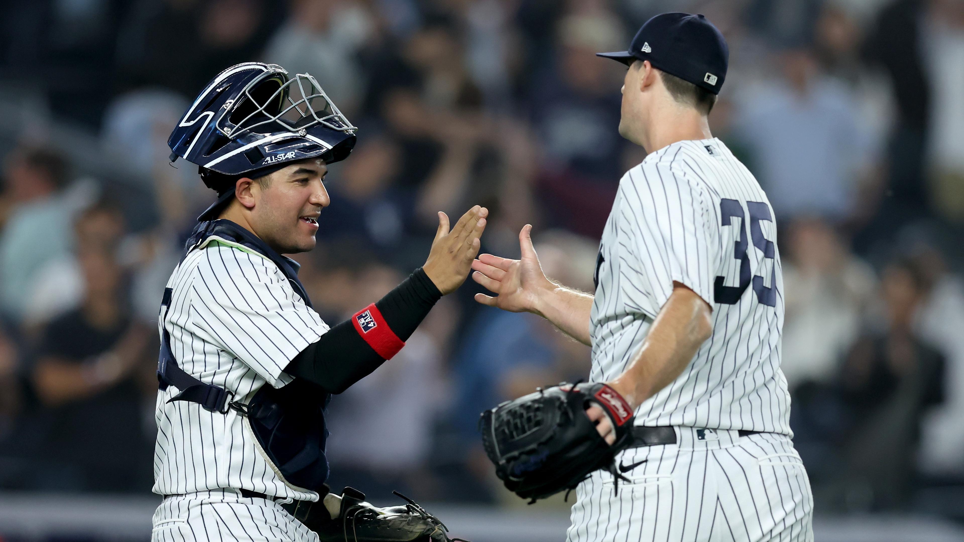 New York Yankees catcher Jose Trevino (39) and relief pitcher Clay Holmes (35) celebrate after defeating the Los Angeles Angels at Yankee Stadium. / Brad Penner-USA TODAY Sports