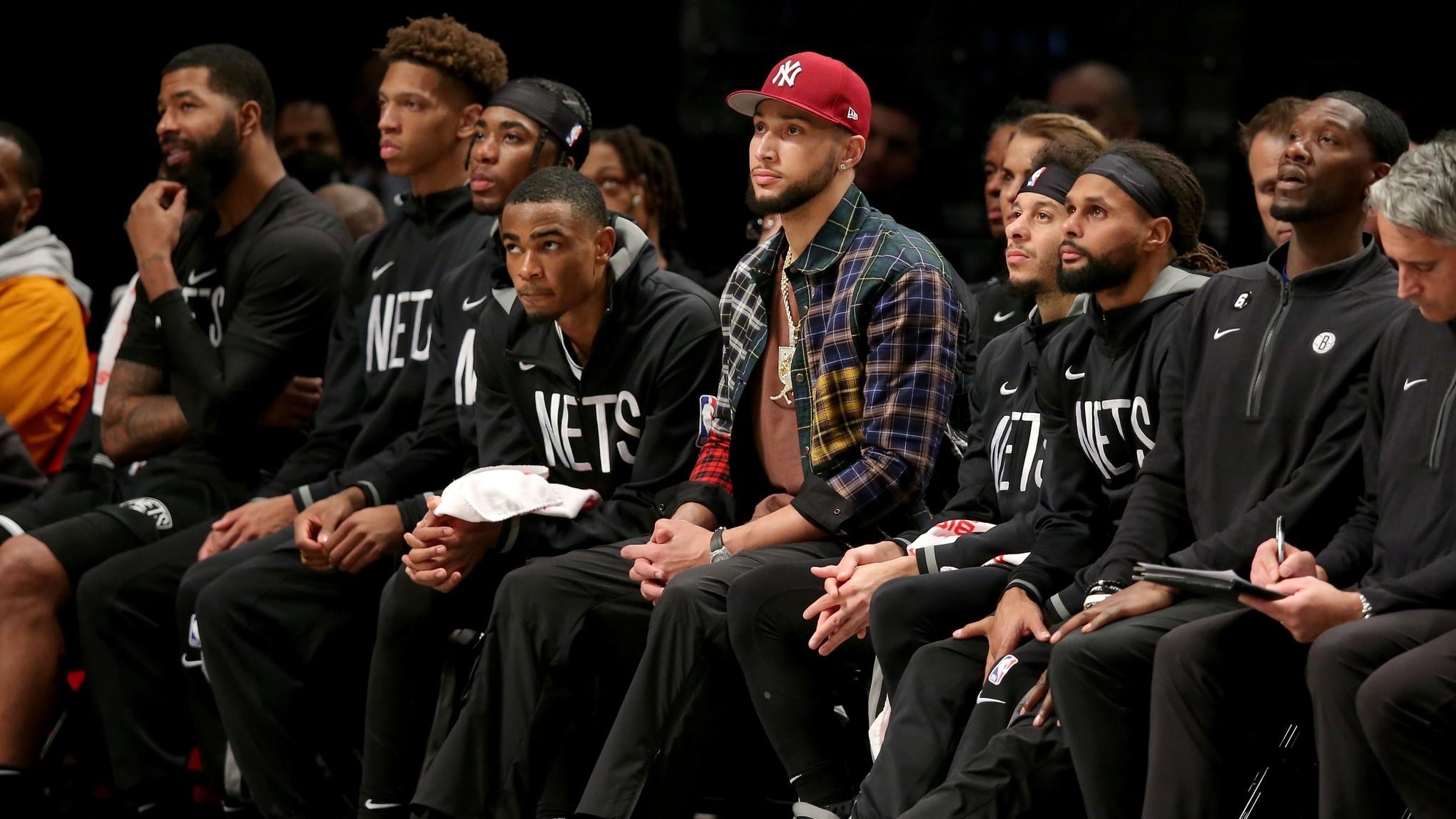 Brooklyn Nets guard Ben Simmons sits on the bench with guards Seth Curry and Patty Mills. / Brad Penner-USA TODAY Sports