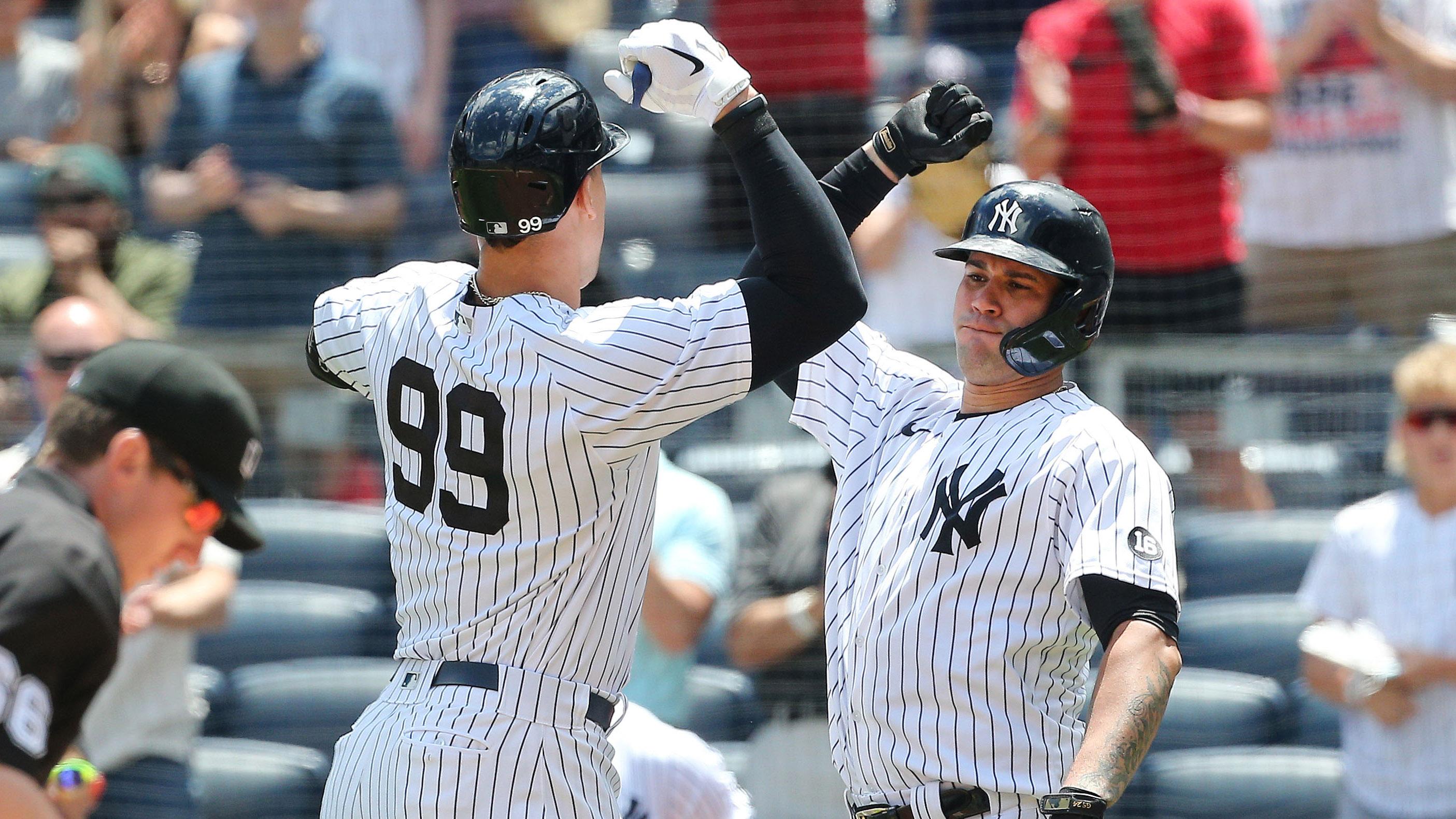 New York Yankees right fielder Aaron Judge (99) is congratulated by catcher Gary Sanchez (24) after hitting a solo home run against the Kansas City Royals during the first inning at Yankee Stadium. / Andy Marlin-USA TODAY Sports