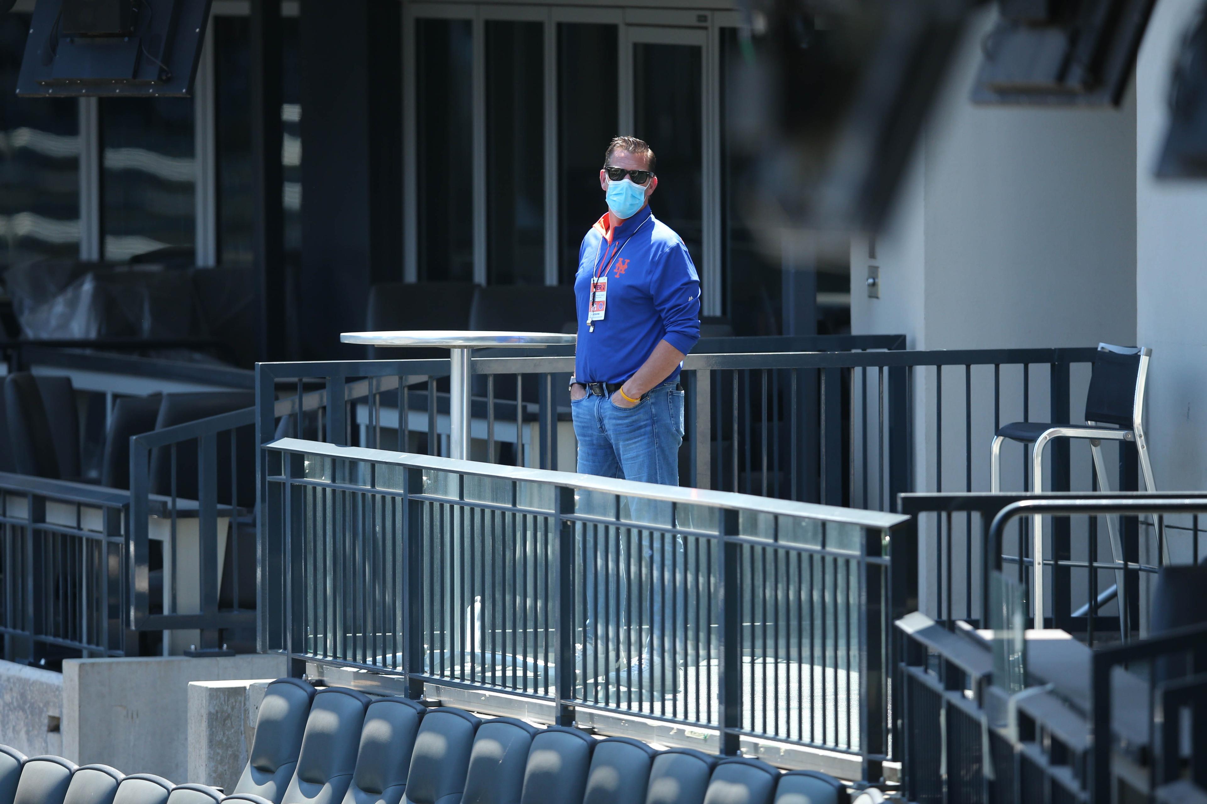 Brodie Van Wagenen, with a mask on, observes Citi Field / USA TODAY Sports