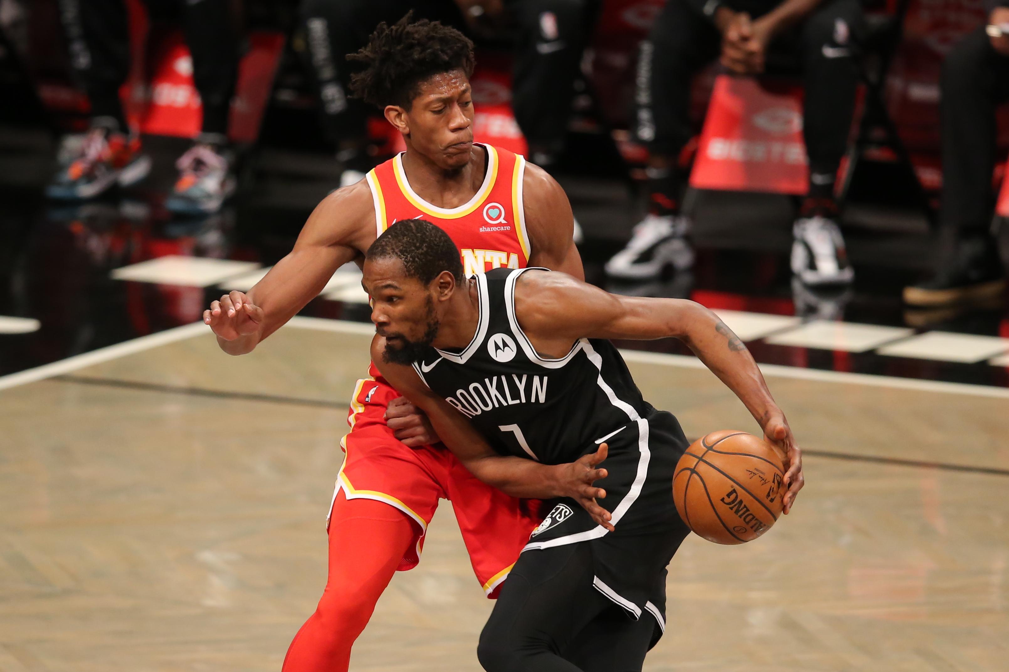 Jan 1, 2021; Brooklyn, New York, USA; Brooklyn Nets small forward Kevin Durant (7) drives to the basket against Atlanta Hawks small forward De'Andre Hunter (back) during the first quarter at Barclays Center. Mandatory Credit: Brad Penner-USA TODAY Sports / © Brad Penner-USA TODAY Sports