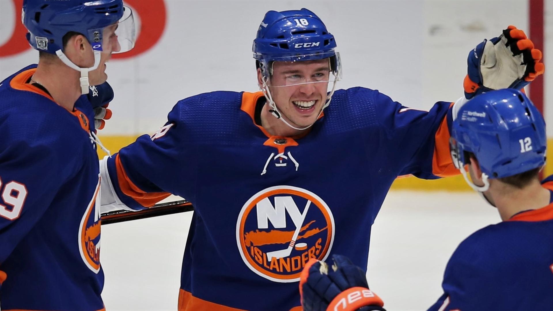 Feb 25, 2021; Uniondale, New York, USA; New York Islanders left wing Anthony Beauvillier (18) celebrates his goal against the Boston Bruins with centers Brock Nelson (29) and Josh Bailey (12) and defenseman Andy Greene (4) during the third period at Nassau Veterans Memorial Coliseum. / Credit: Brad Penner-USA TODAY Sports