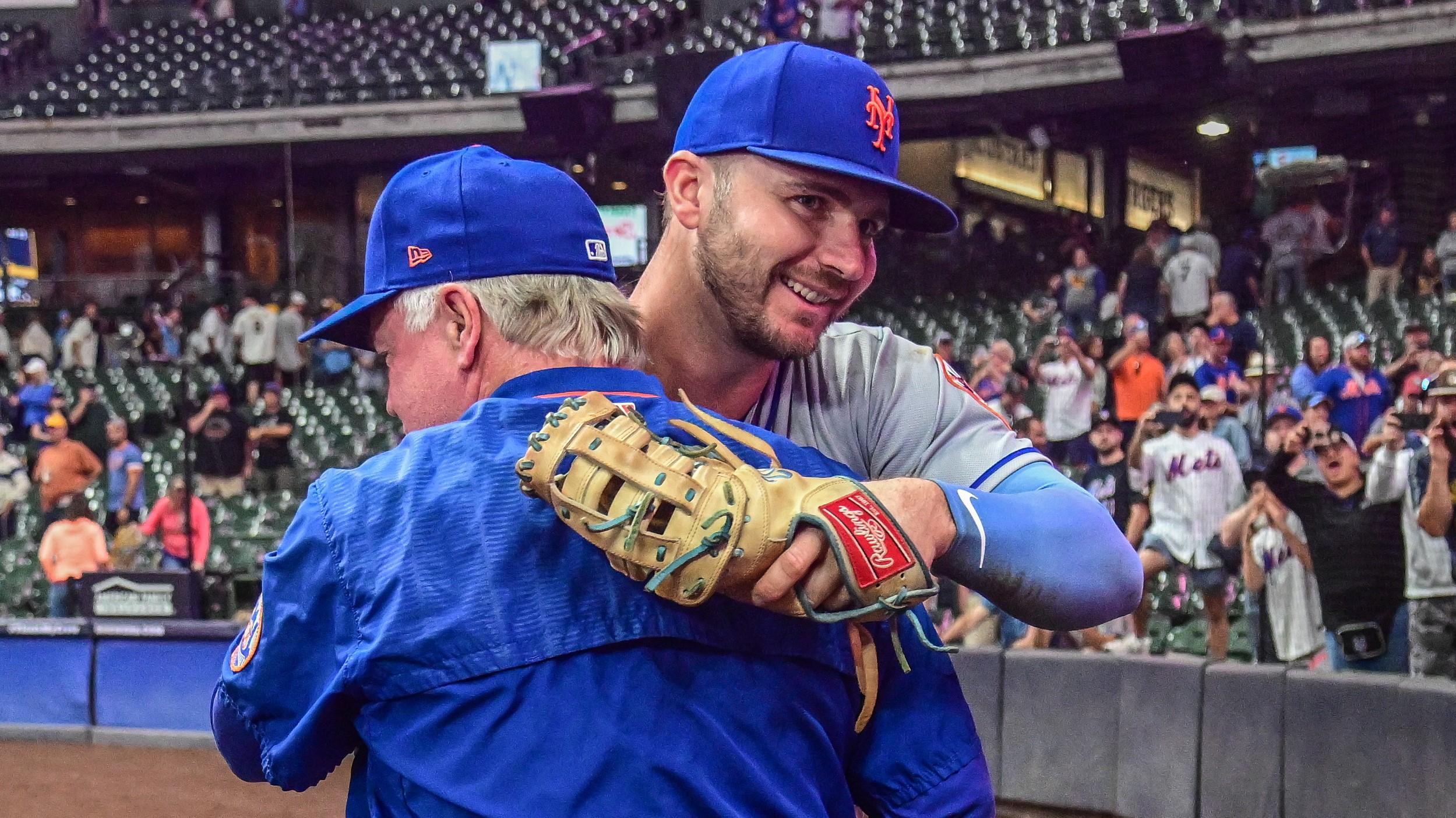 Sep 19, 2022; Milwaukee, Wisconsin, USA; New York Mets first baseman Pete Alonso (20) hugs manager Buck Showalter after the Mets clinched a playoff spot by beating the Milwaukee Brewers at American Family Field. Mandatory Credit: Benny Sieu-USA TODAY Sports / © Benny Sieu-USA TODAY Sports