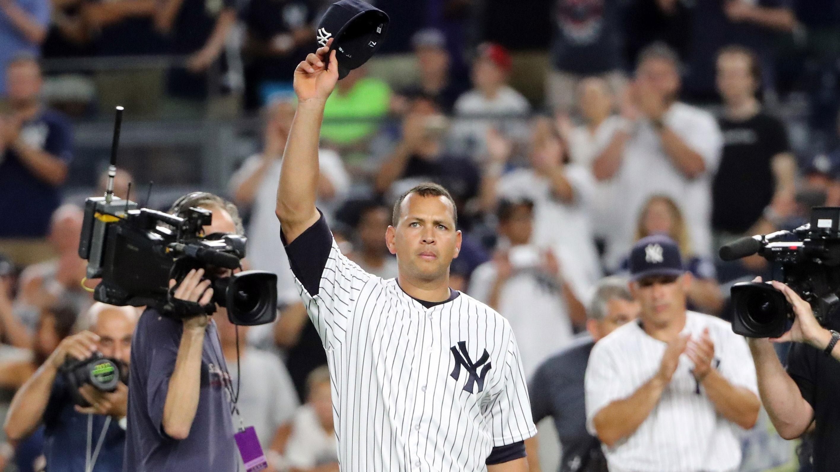 Aug 12, 2016; Bronx, NY, USA; New York Yankees designated hitter Alex Rodriguez (13) tips his cap in a farewell gesture to the fans after the game against the Tampa Bay Rays at Yankee Stadium. New York Yankees won 6-3. / Anthony Gruppuso-USA TODAY Sports